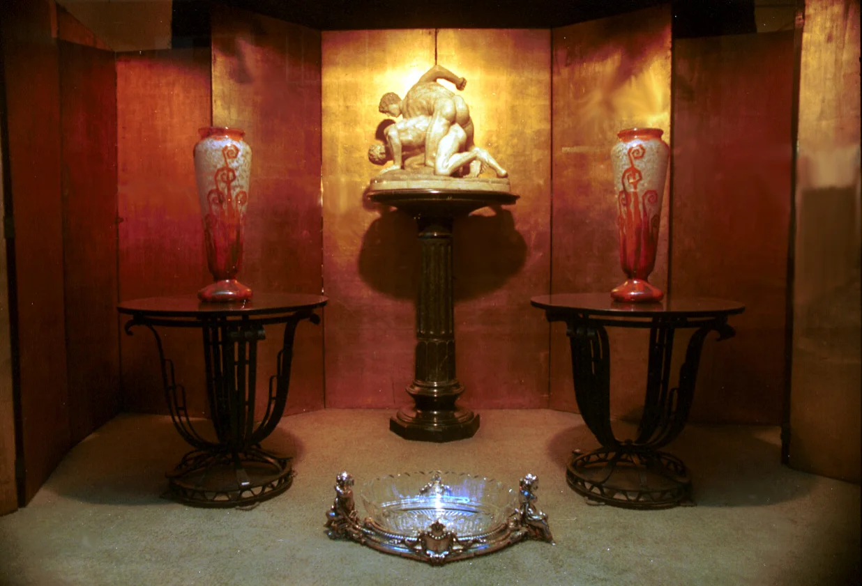 Antique decor featuring statues and colorful vases