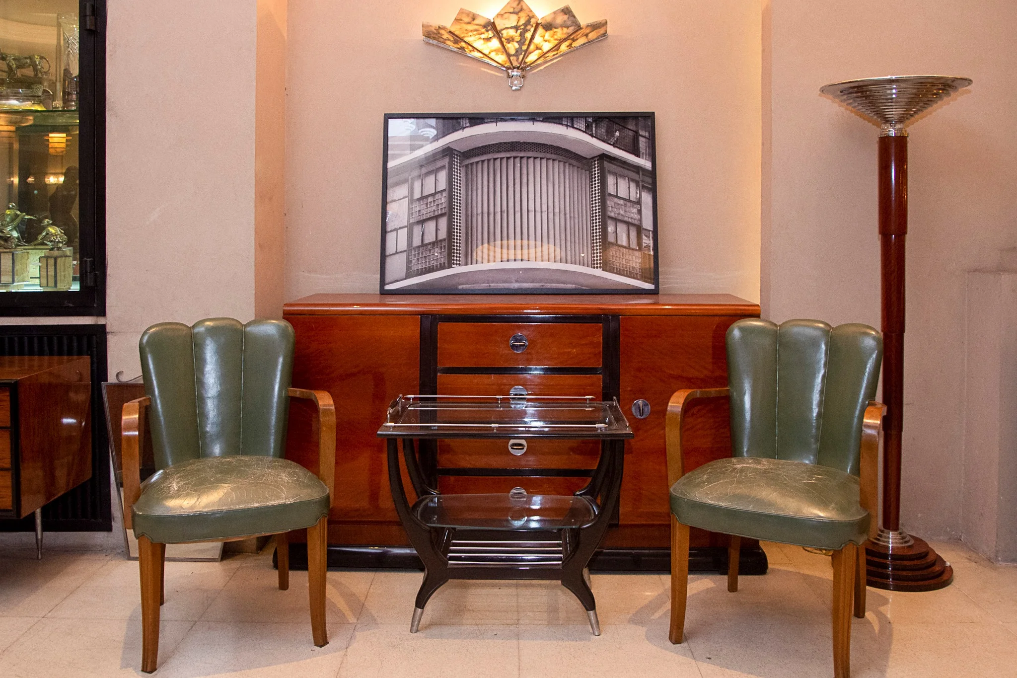 Two antique chairs and a table in Balcarce 1084 San Telmo.