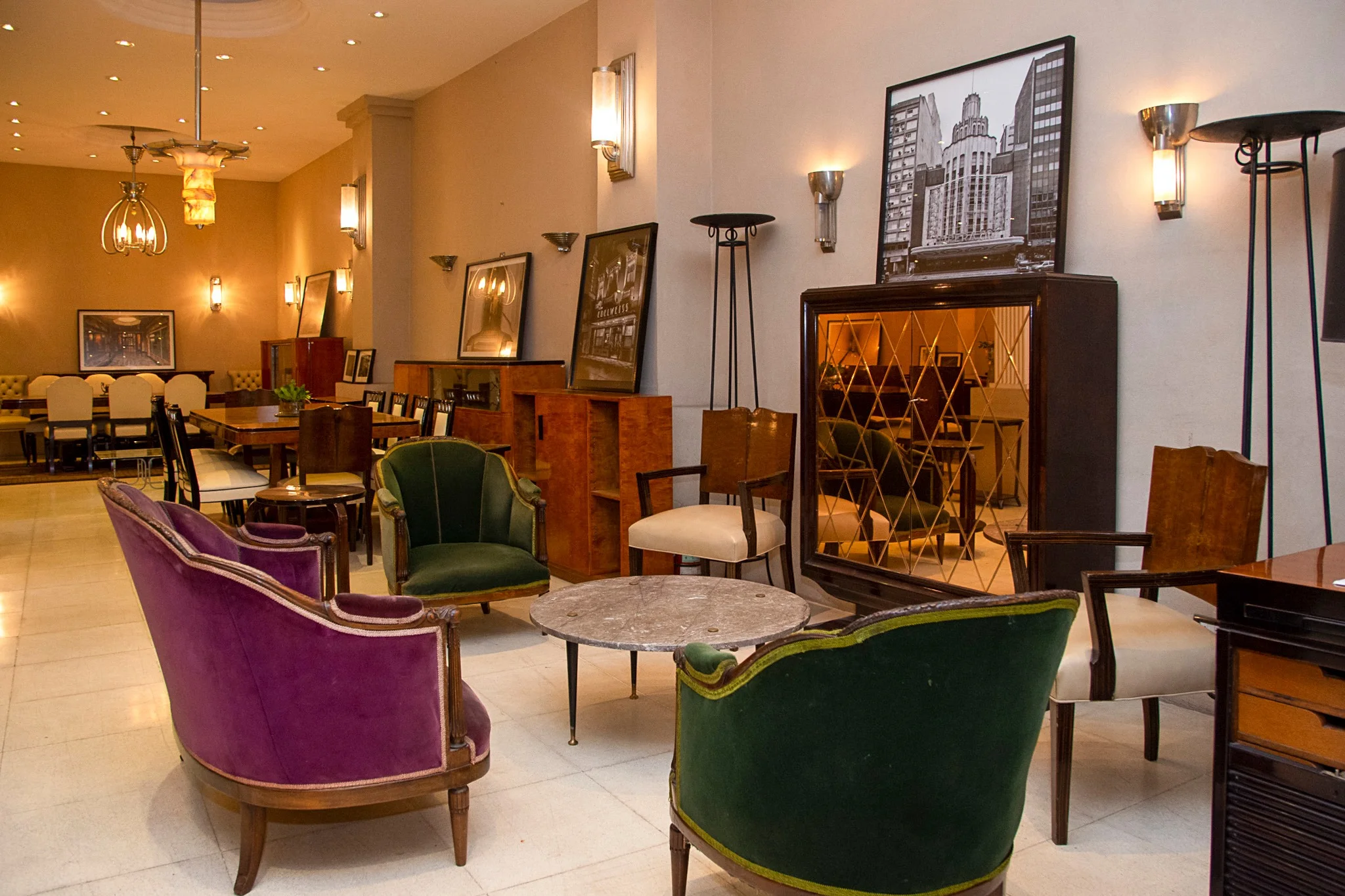 interior of luxury design store with antiques and chairs