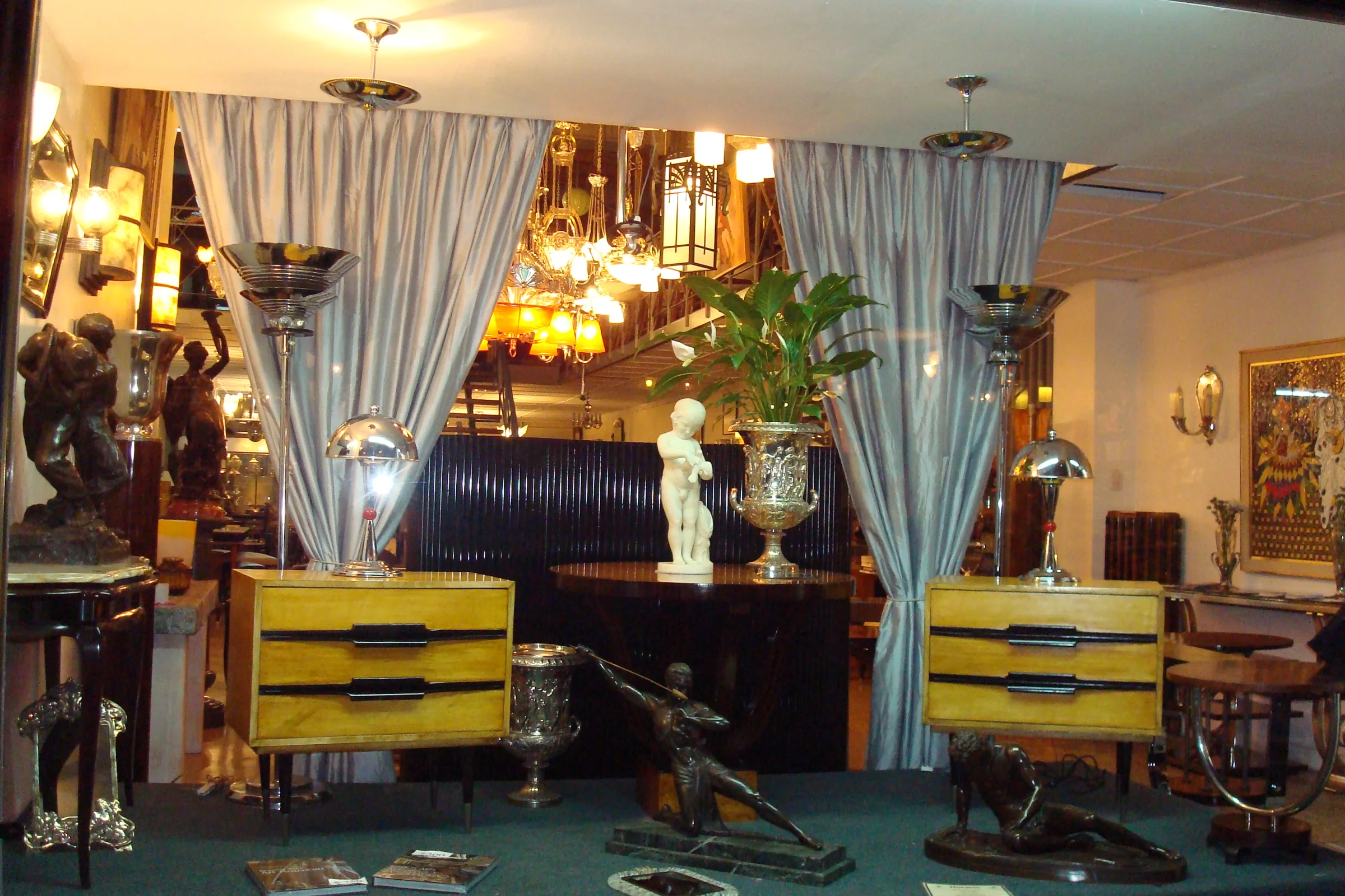 View of Luxury Design Store's headquarters showcasing antique furniture and elegant decor.