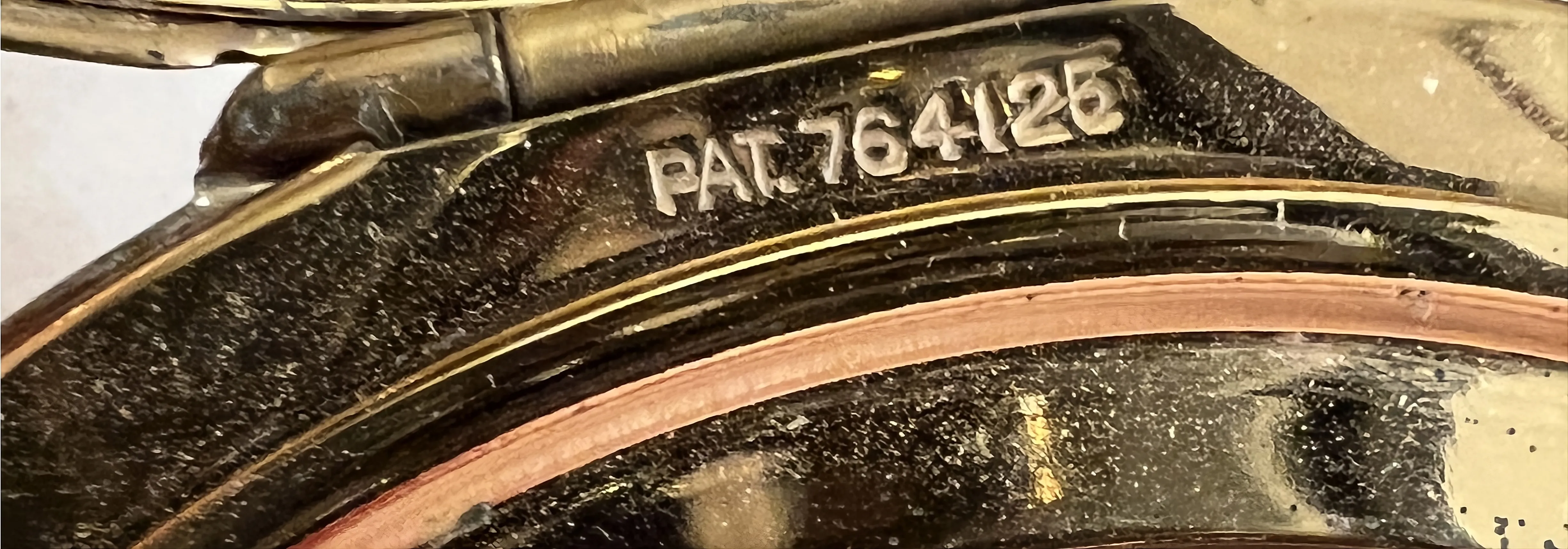 古いシリアル番号pat. 764125の詳細；中立的な背景