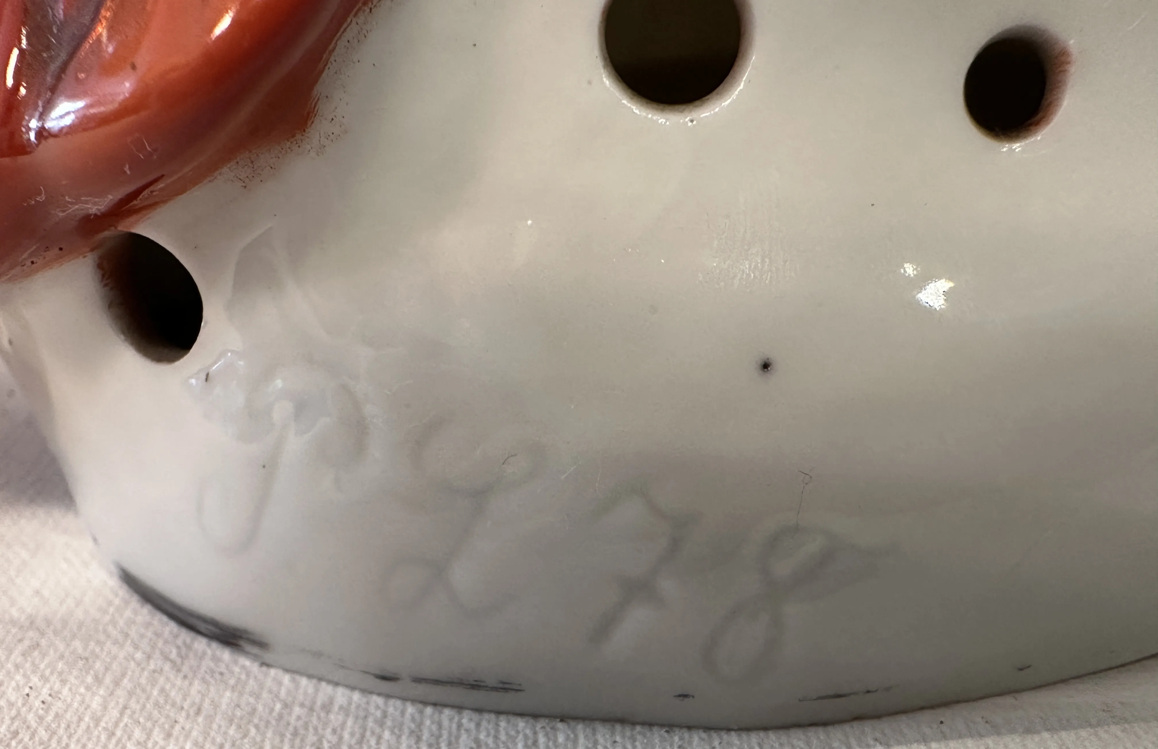 marking on the base of an antique with the text PL 78