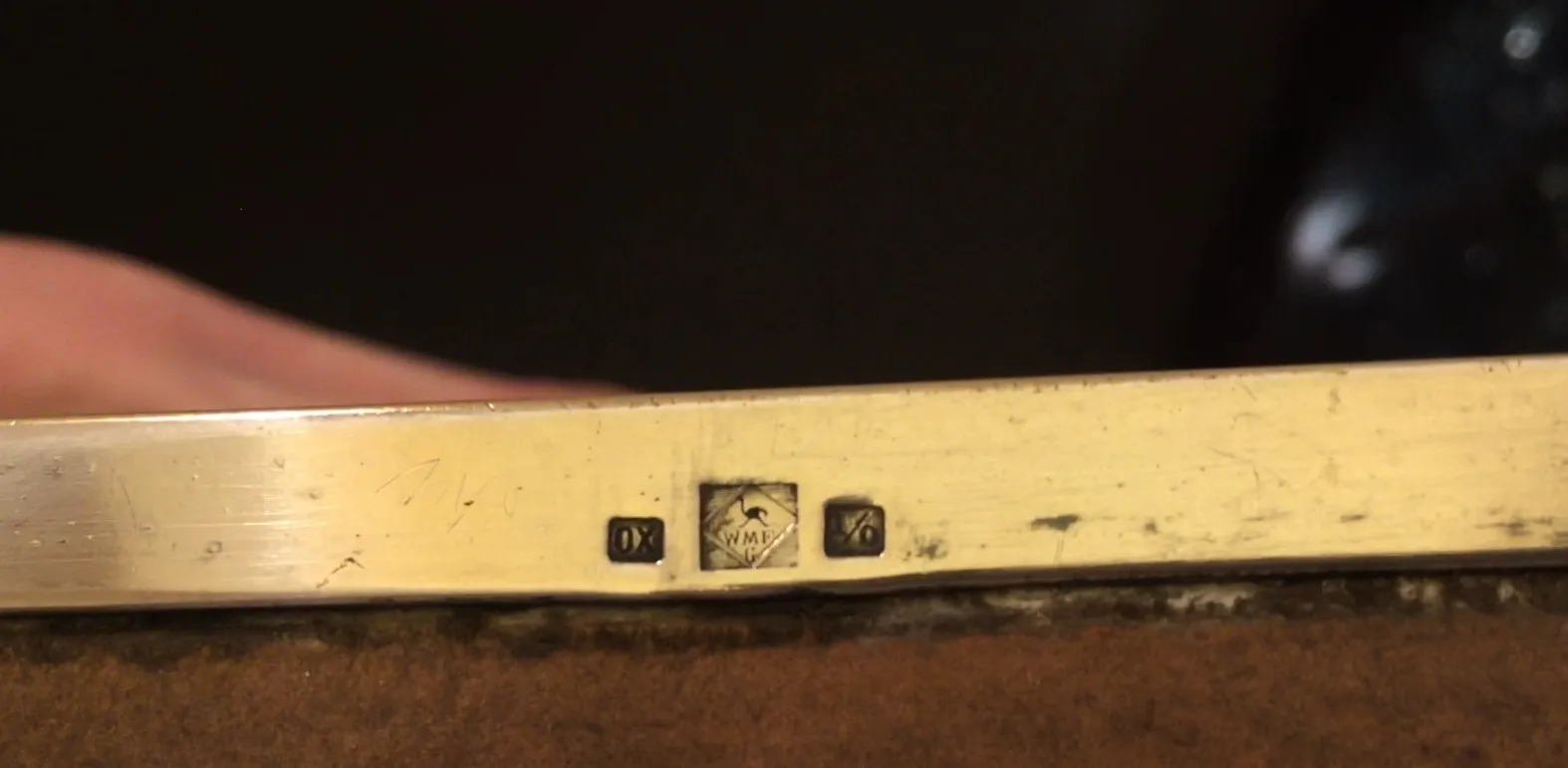 Two antique jewelers with engravings and ornamental details
