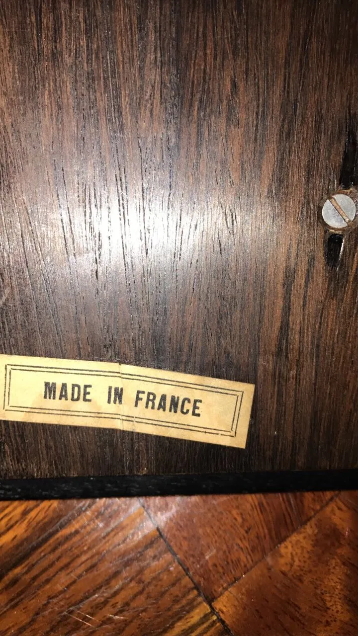 Antique wooden box with a label that says 'Made in France'