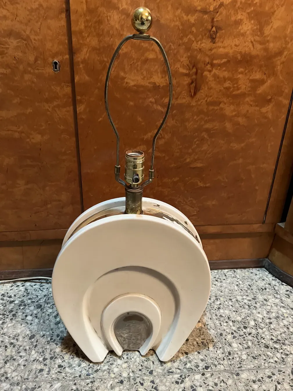 Antique table lamp in Art Deco style, creating a warm atmosphere.