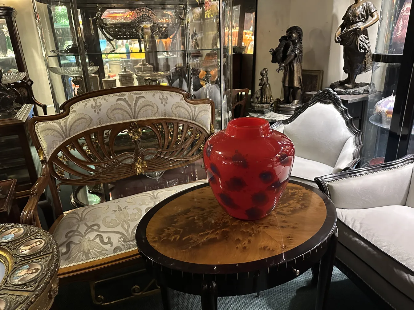 Red glass vase featuring Schneider's signature decoration