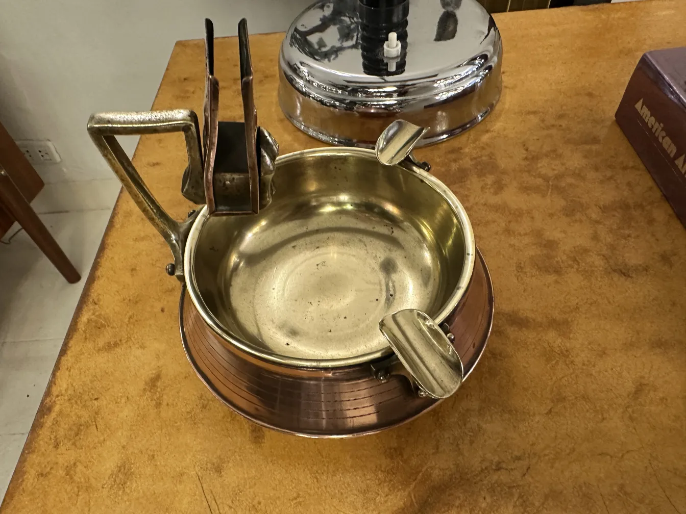 Antique ashtray on table with black surface