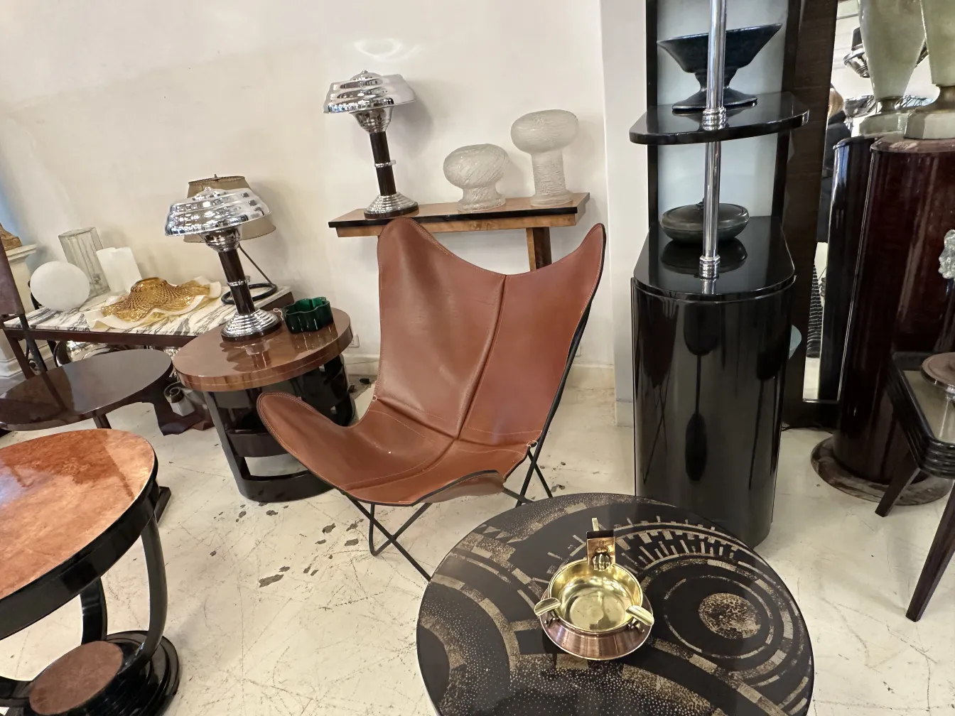 Antique ashtray on table with black surface