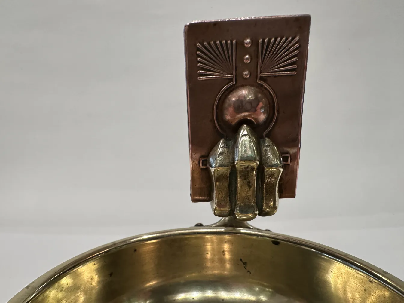Antique ashtray on table with black surface