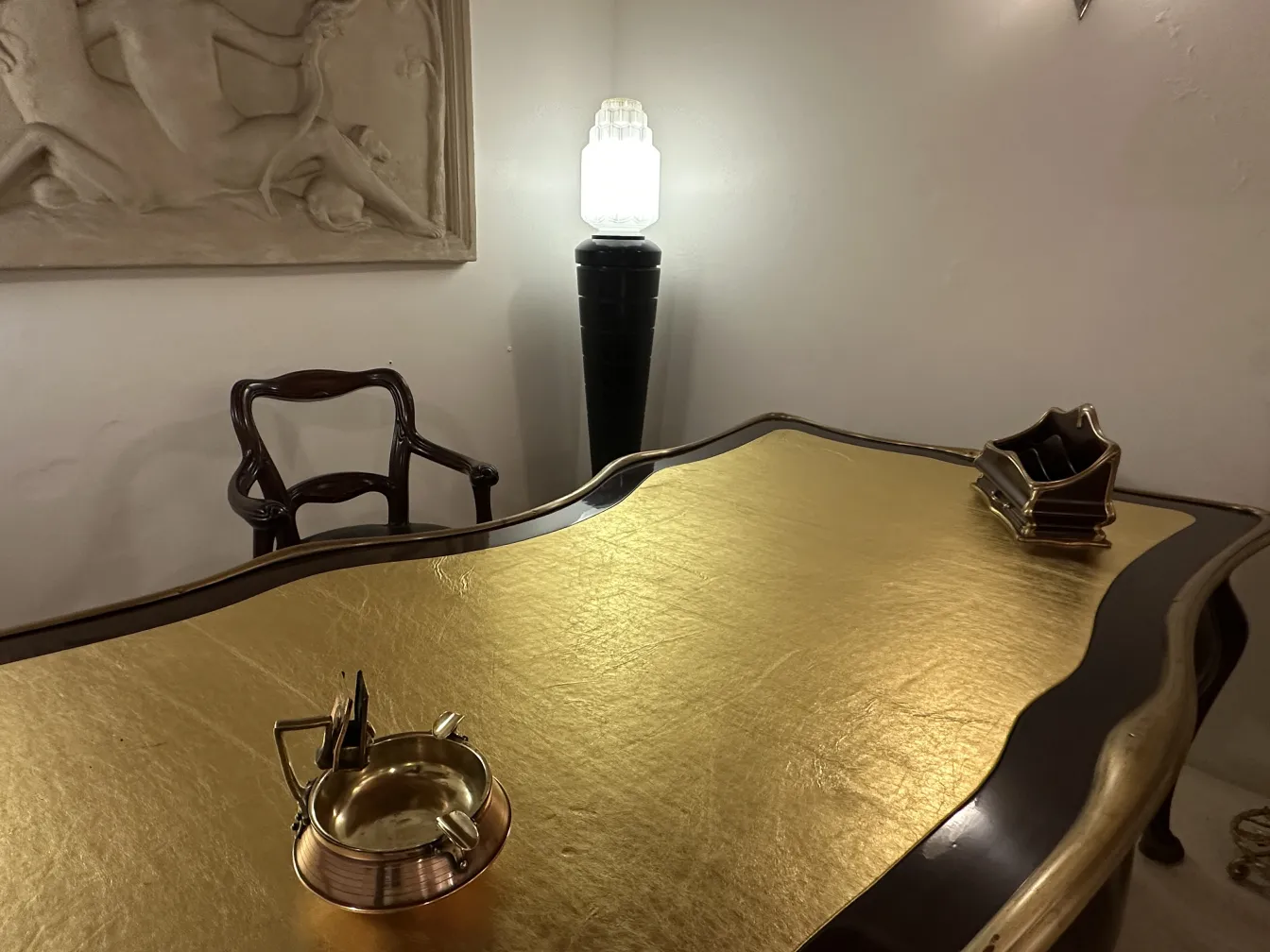 Antique ashtray on table with black surface