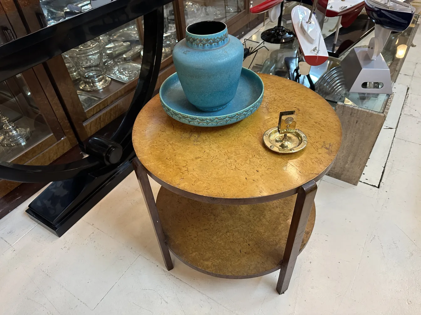 Antique WMF ashtray with decorative design and circular shape.