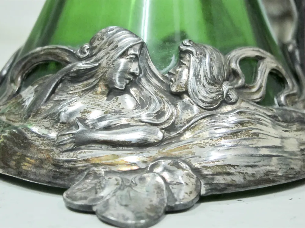 Close-up of 2 WMF jars with floral decorations on the lid