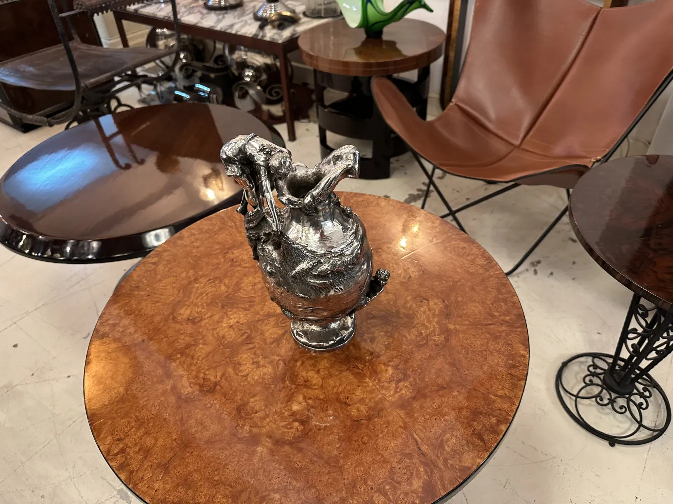 Two antique decorative jars on a wooden table
