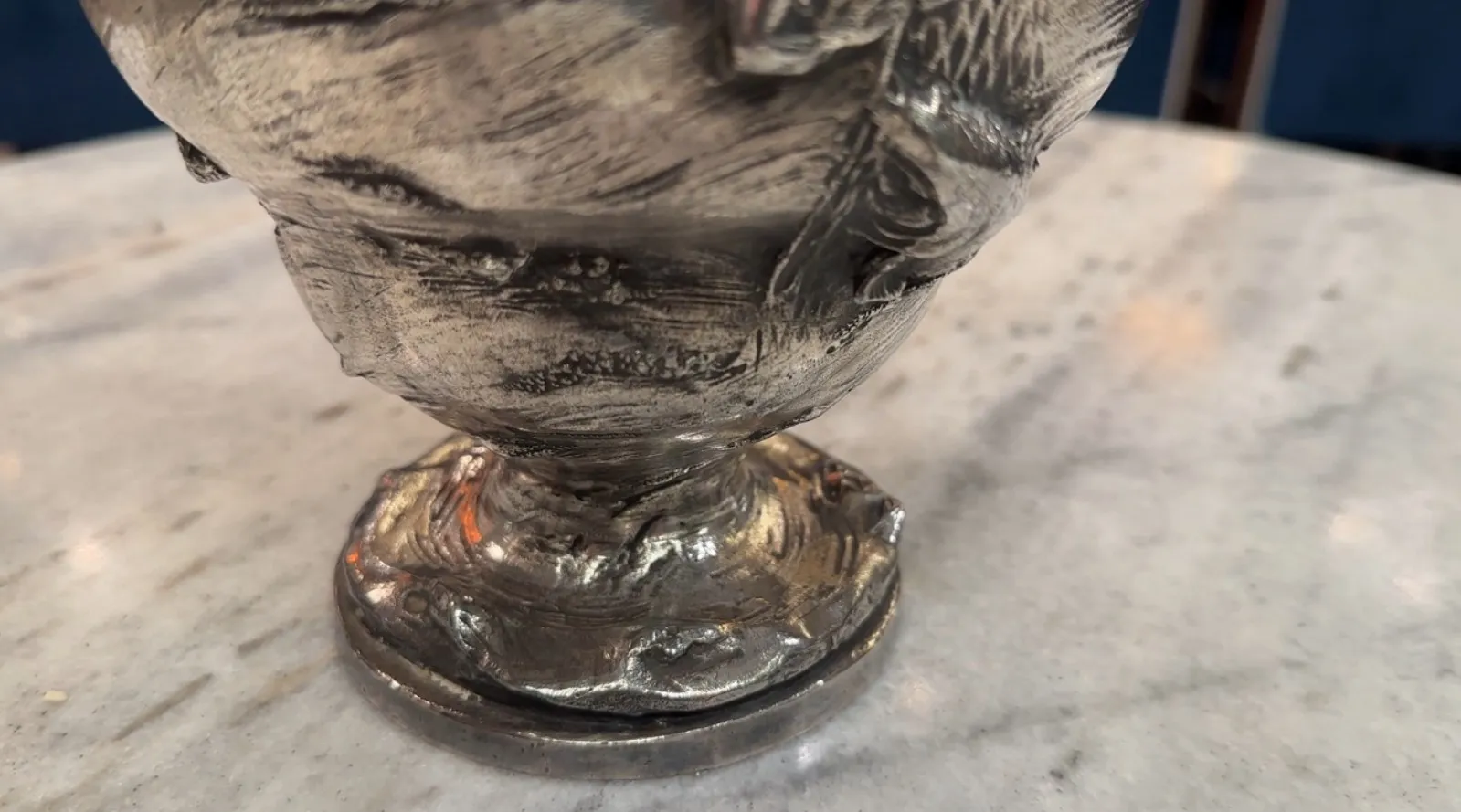Two antique jars with decorative details in an elegant setting.