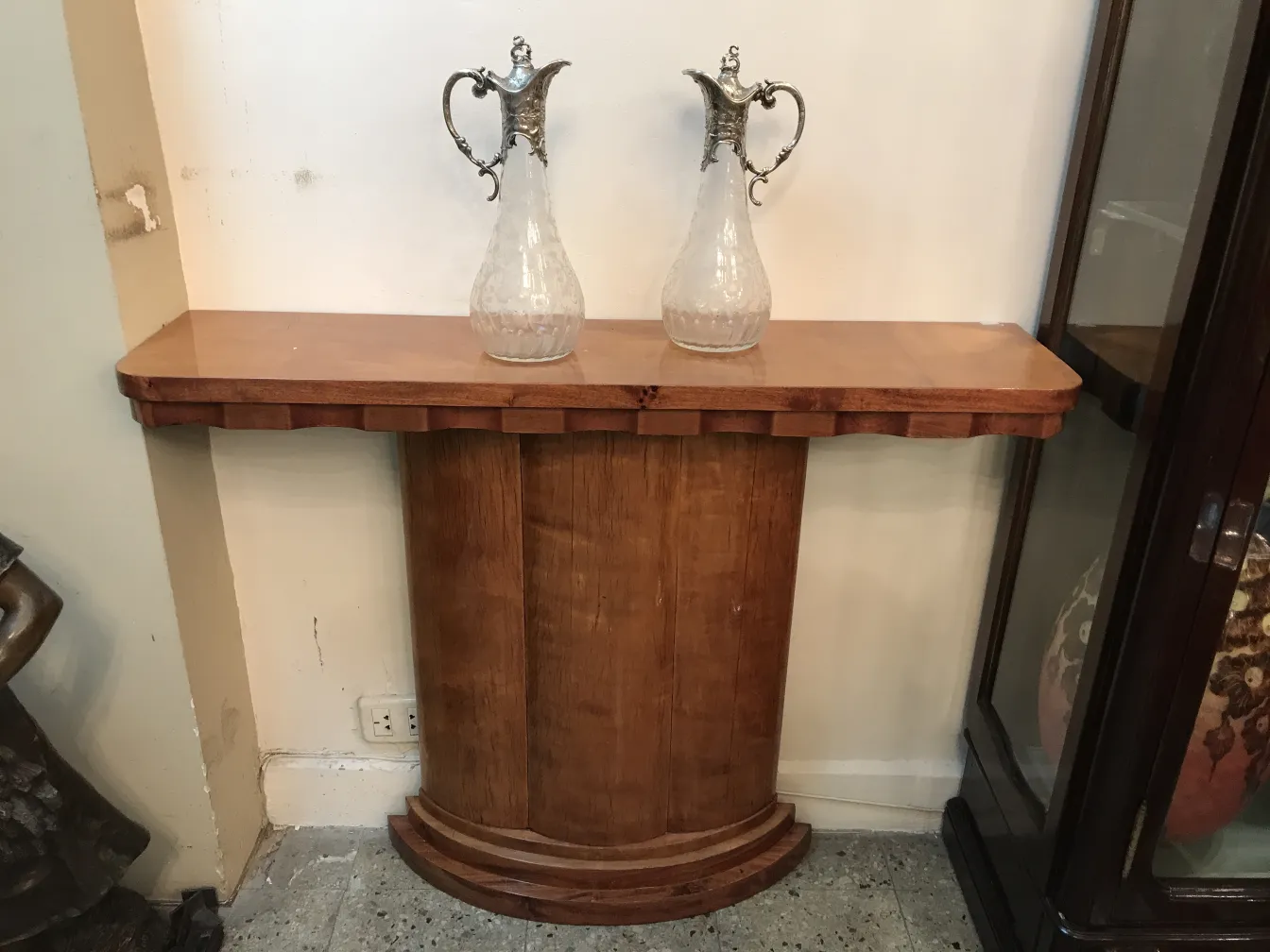 two antique WMF jars with intricate design and decorative handles, in an elegant setting