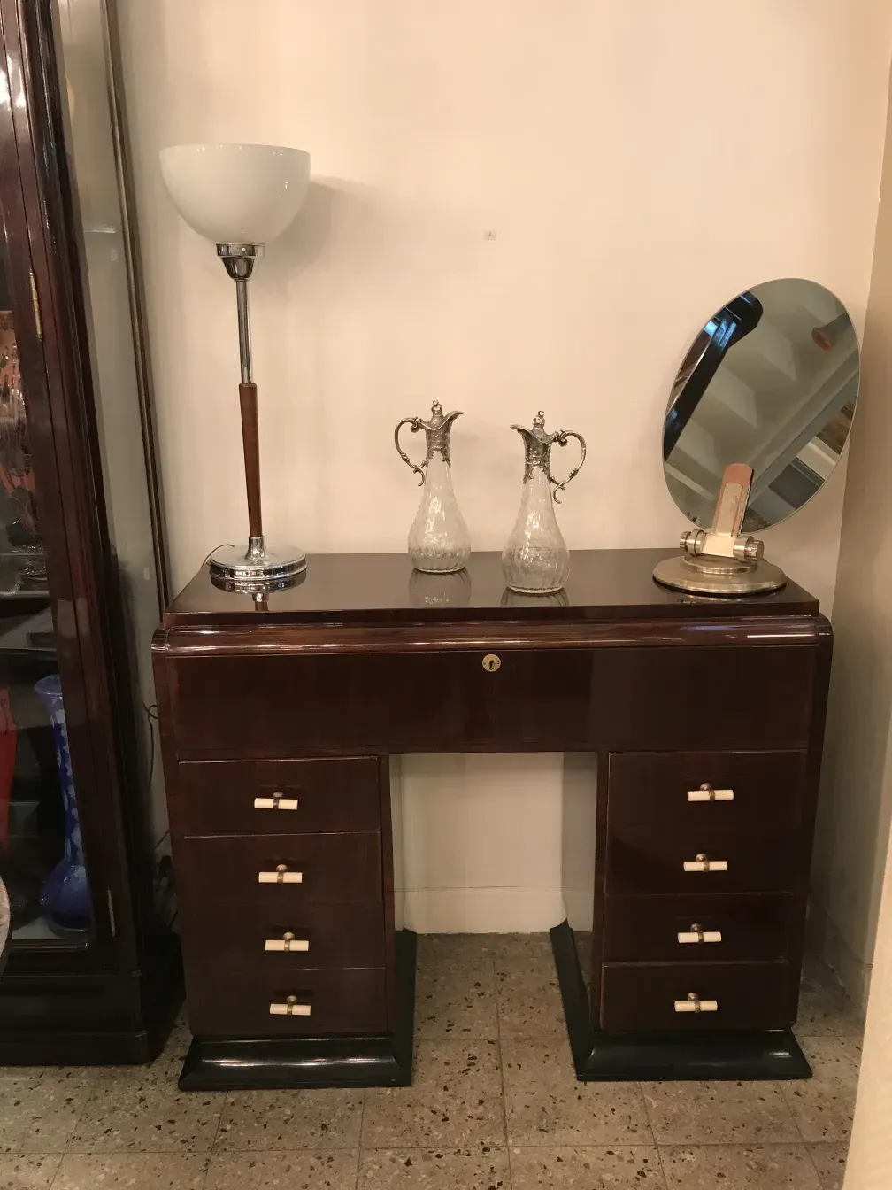 two antique WMF jars with intricate design and decorative handles, in an elegant setting