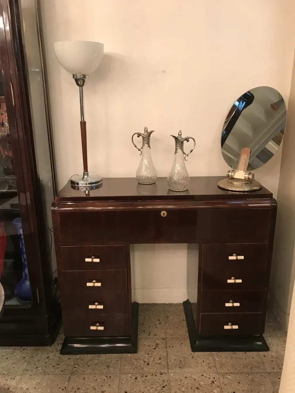 two antique WMF jars with intricate design and decorative handles, in an elegant setting