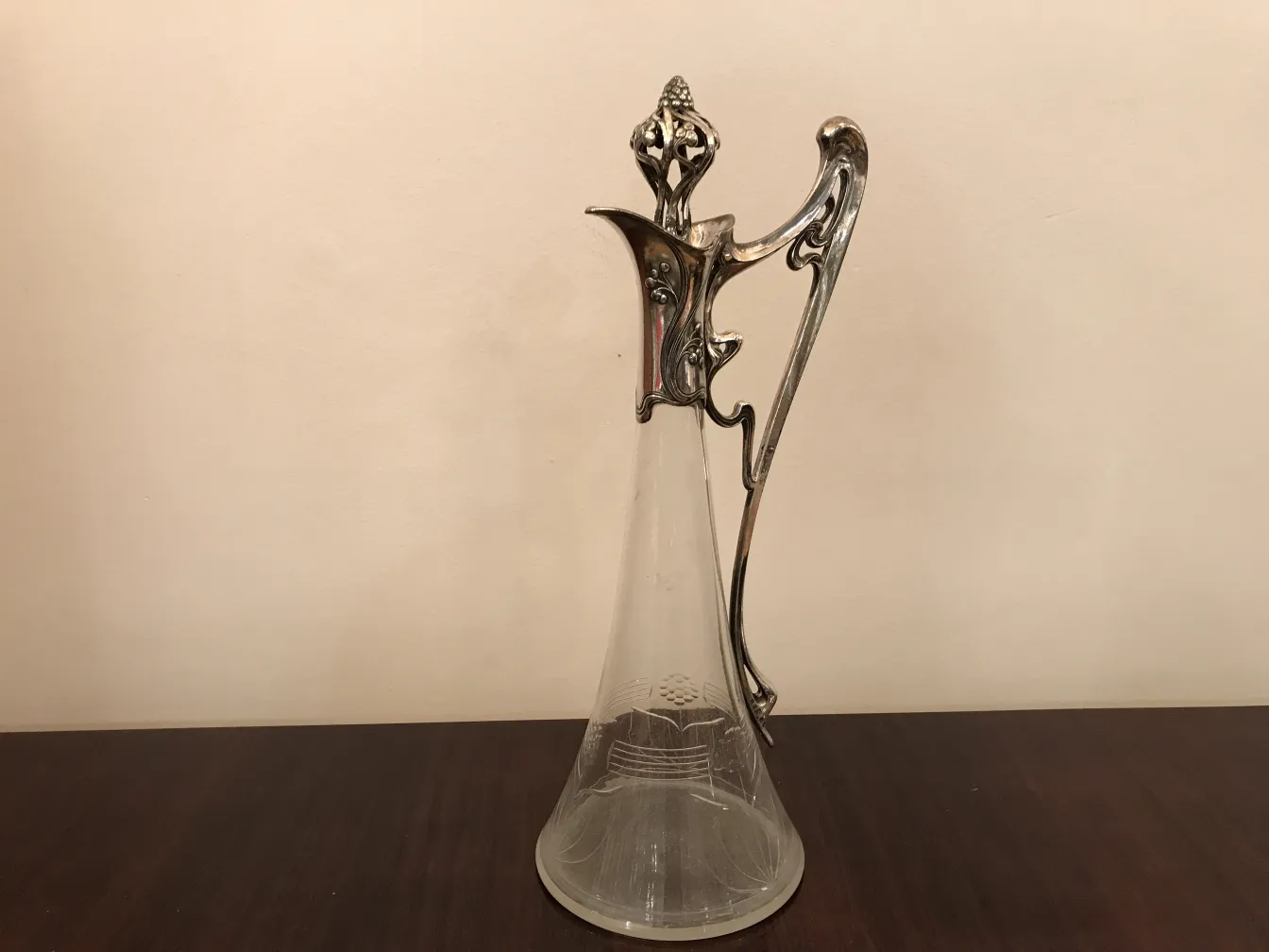 Antique jar with beautiful floral details in the design.