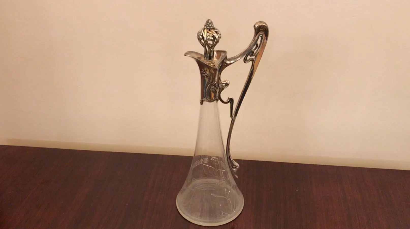 Antique jar with beautiful floral details in the design.