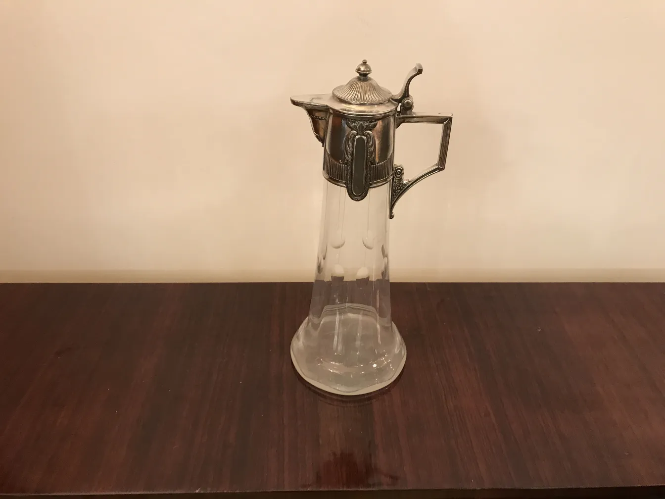 Antique WMF jar with an elegant glass and metal design, perfect for decor.