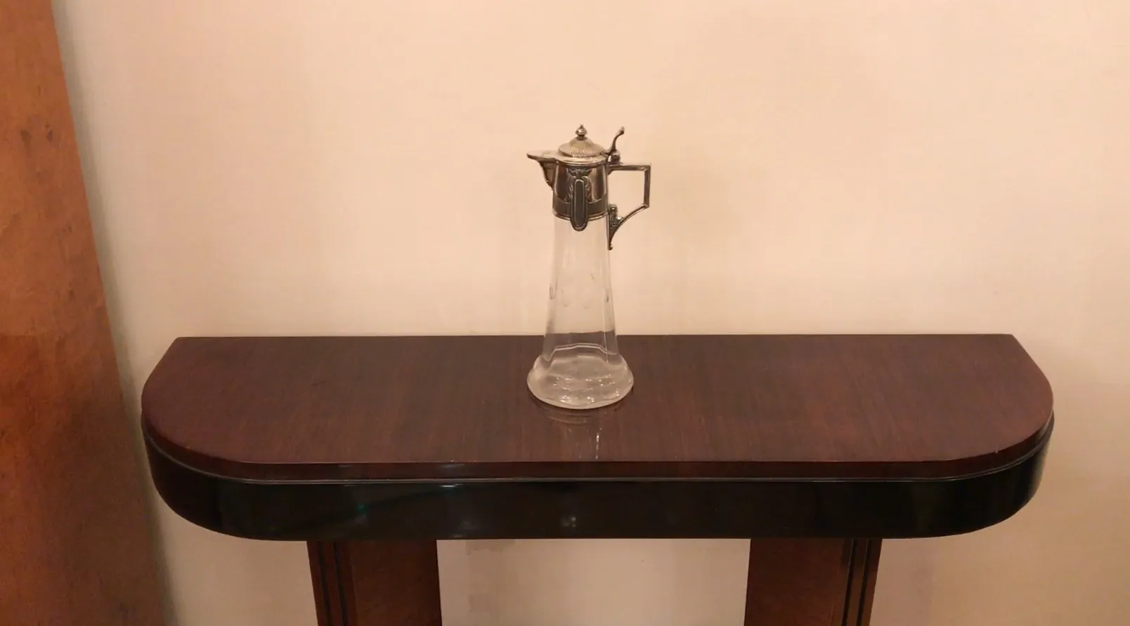 Antique WMF jar with an elegant glass and metal design, perfect for decor.