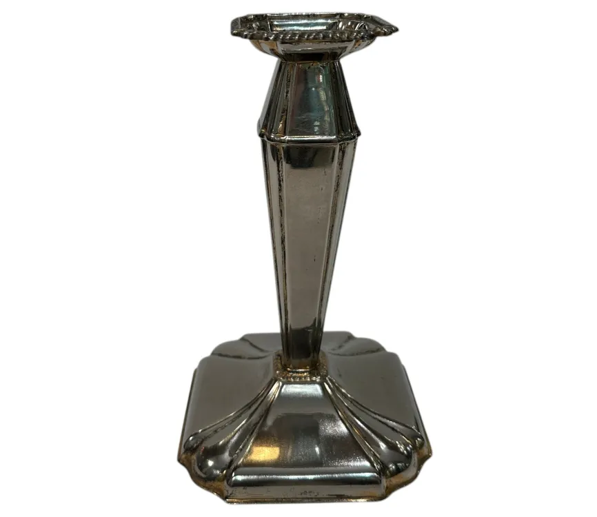 Antique decorative candelabra featuring elegant base and symmetrical design.