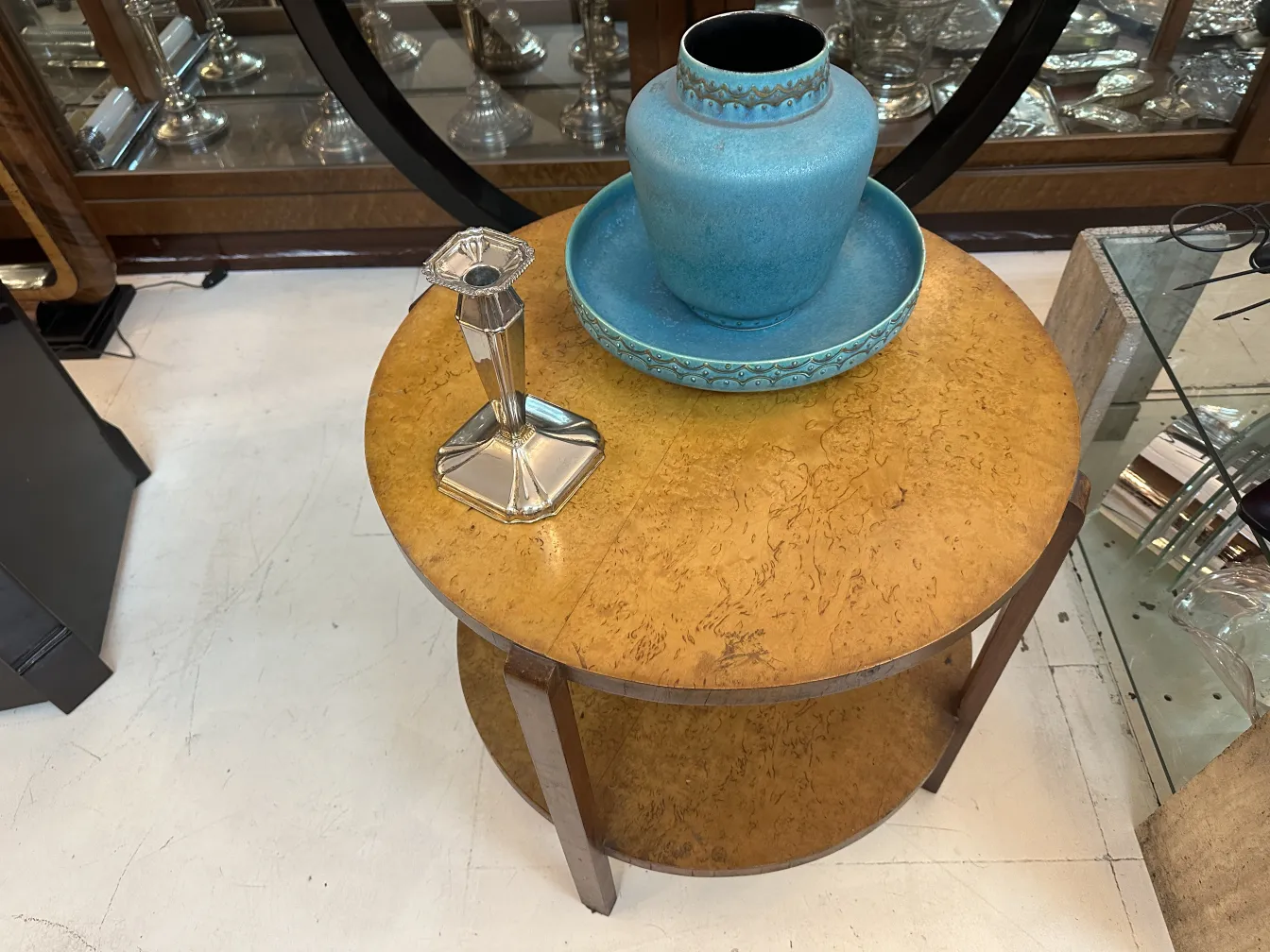 Antique decorative candelabra featuring elegant base and symmetrical design.