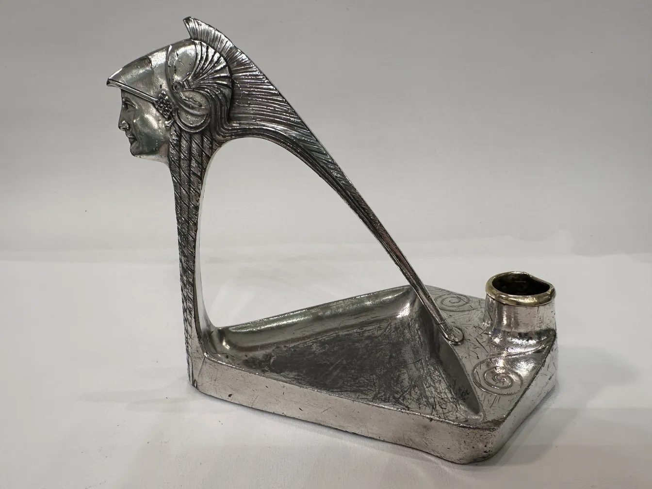 antique candelabra with decorative figure and artistic details