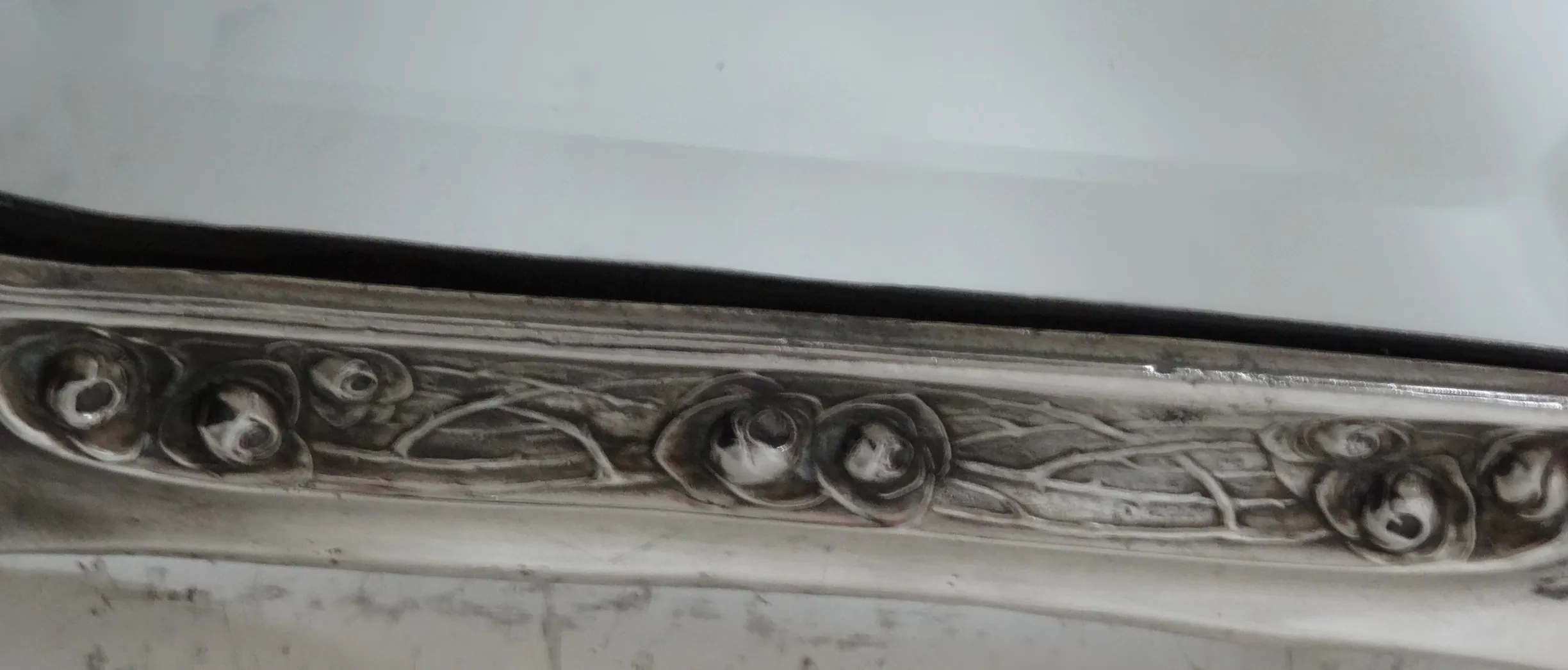 antique mirror with an ornate frame and elegant style