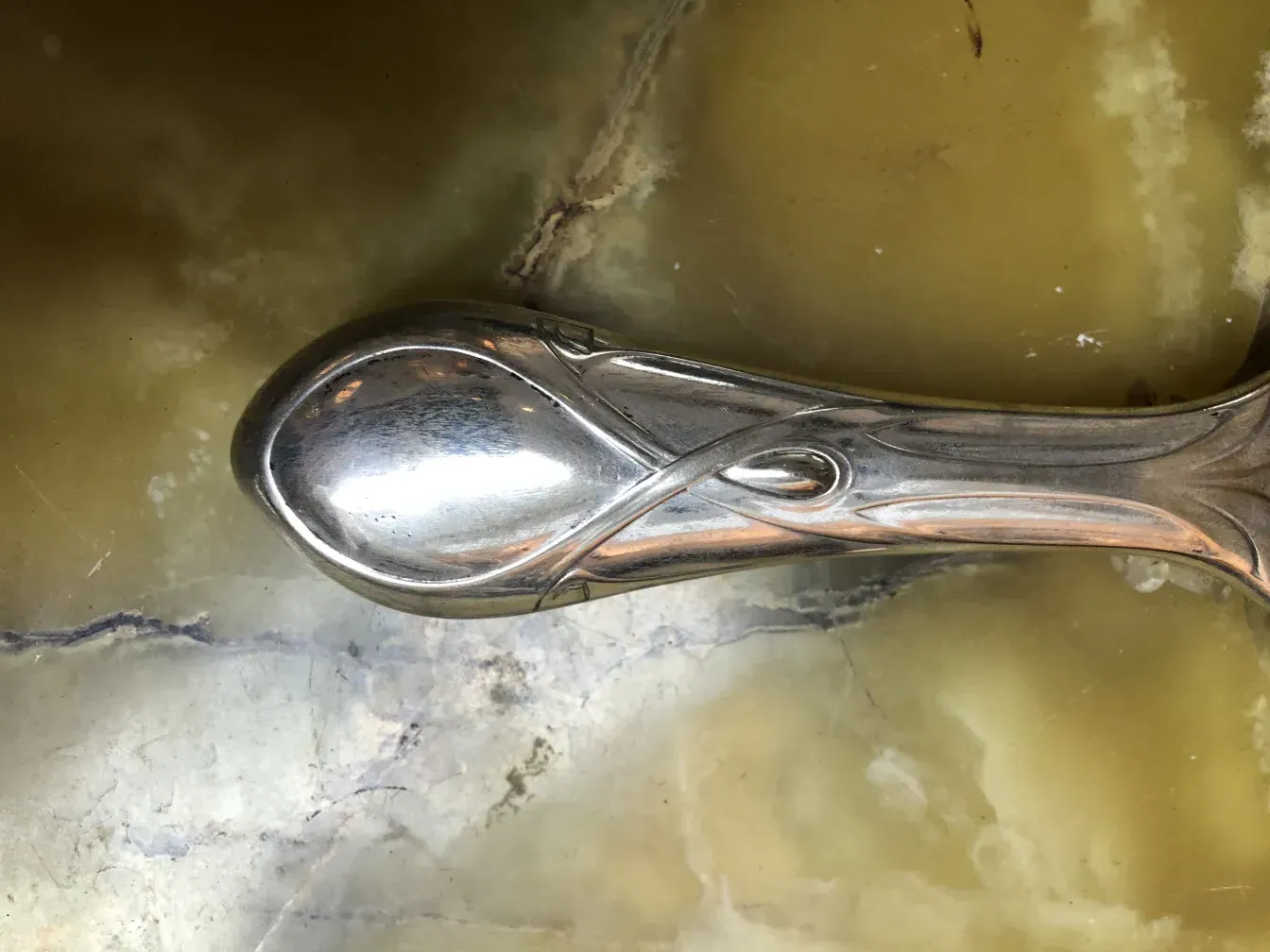 Antique hand mirror with an elegant design