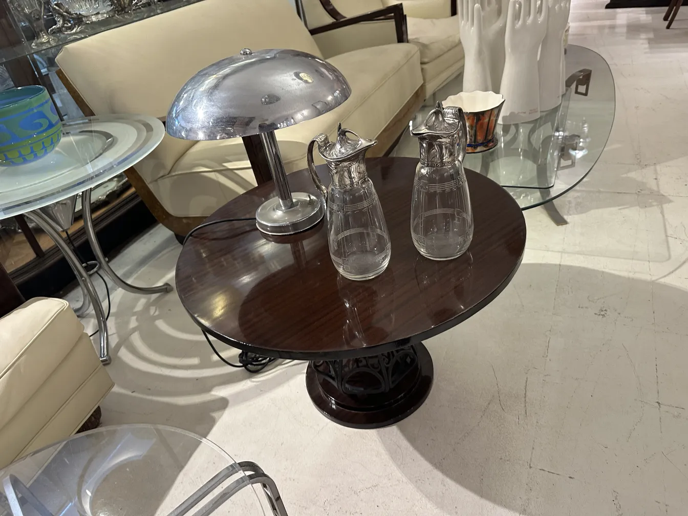 Two antique WMF jars featuring decorative details and an elegant design in a classic setting.