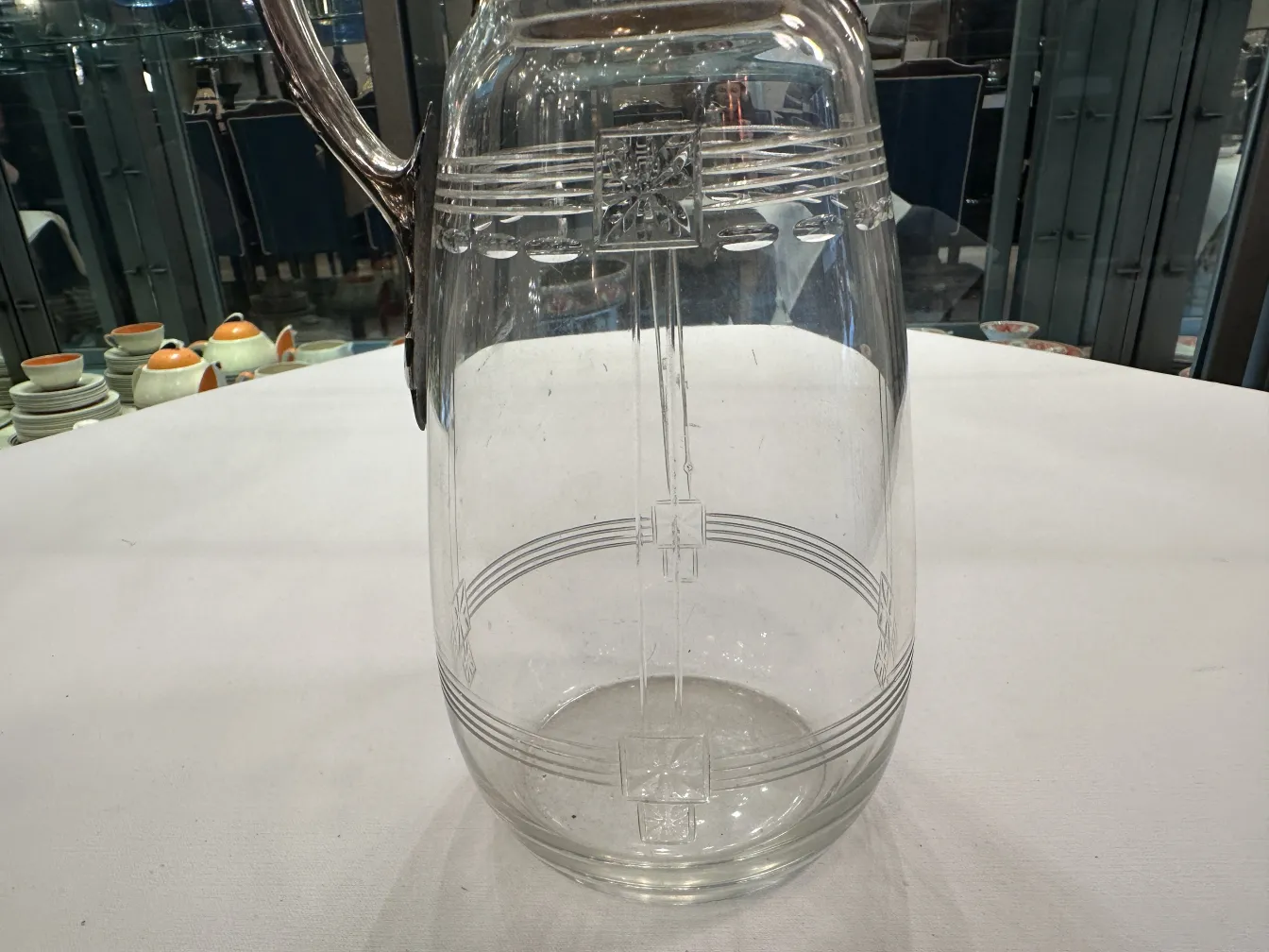 Two antique WMF jars featuring decorative details and an elegant design in a classic setting.