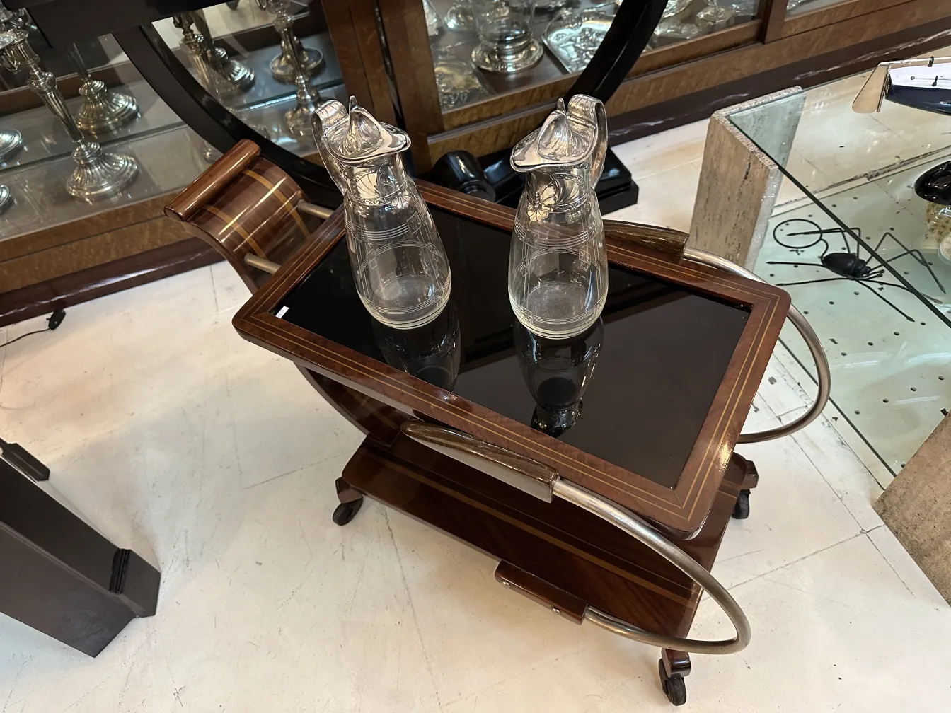 Two antique WMF jars featuring decorative details and an elegant design in a classic setting.