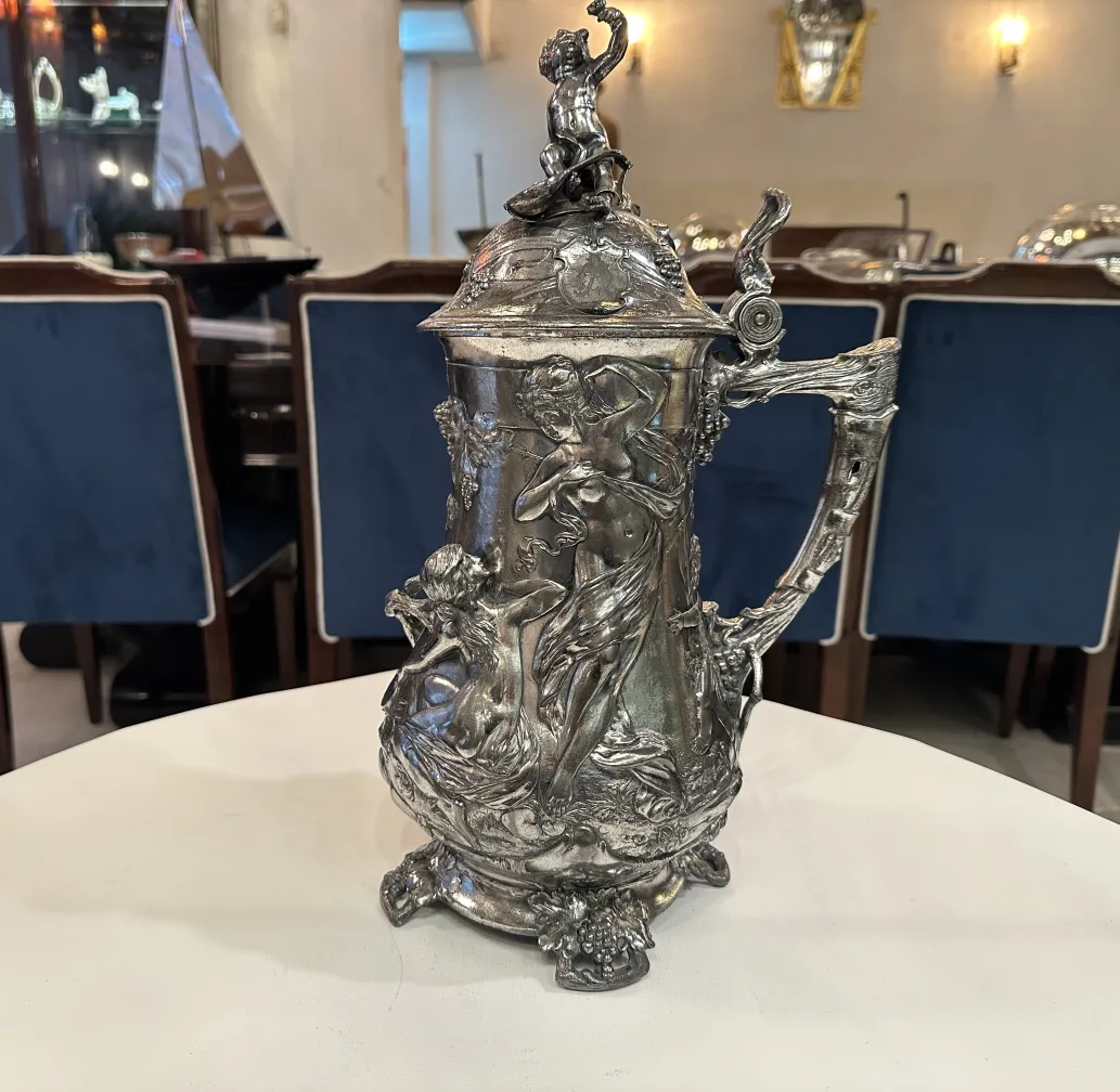 antique hot chocolate jug with decorative figures