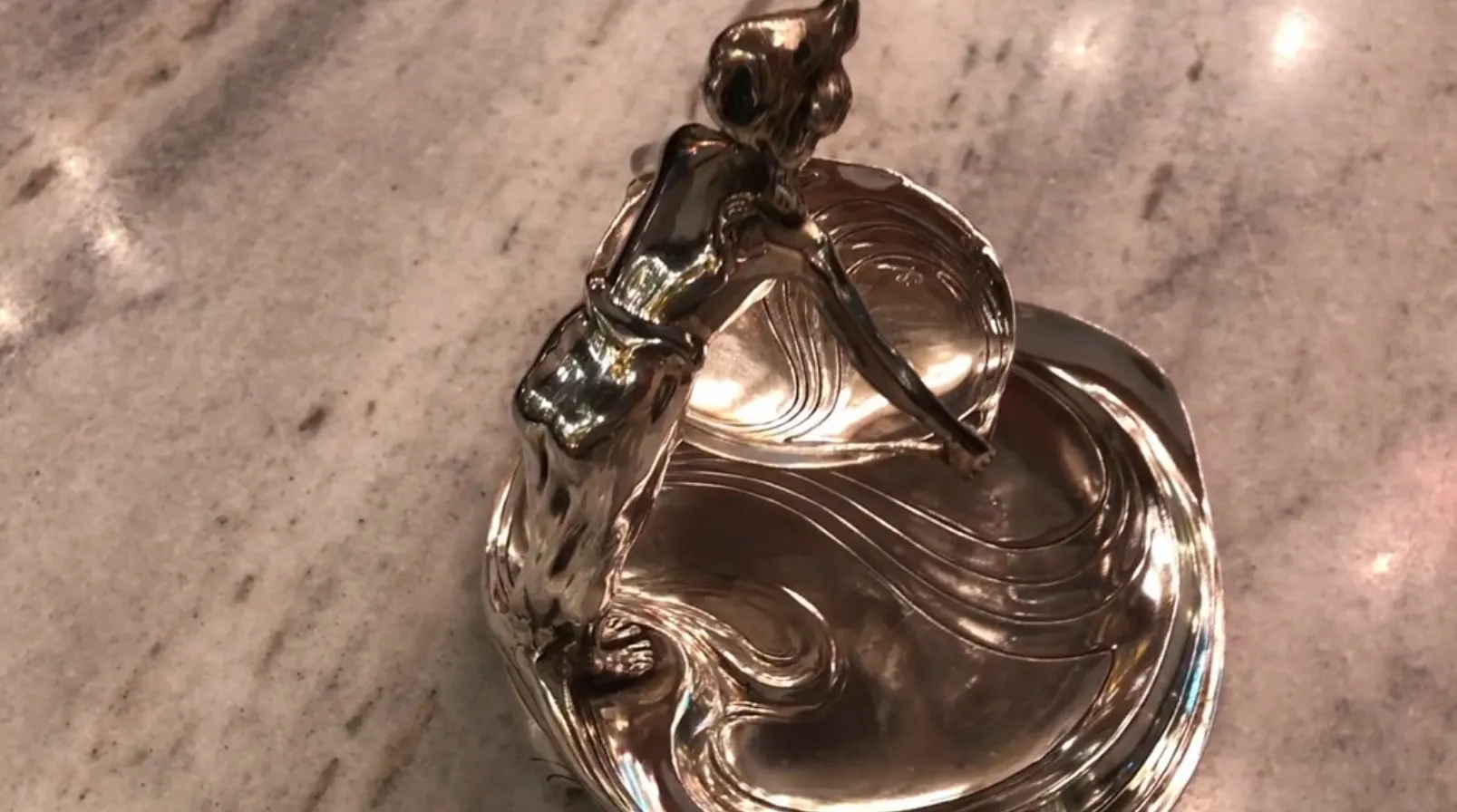 antique tray with a moving woman figure