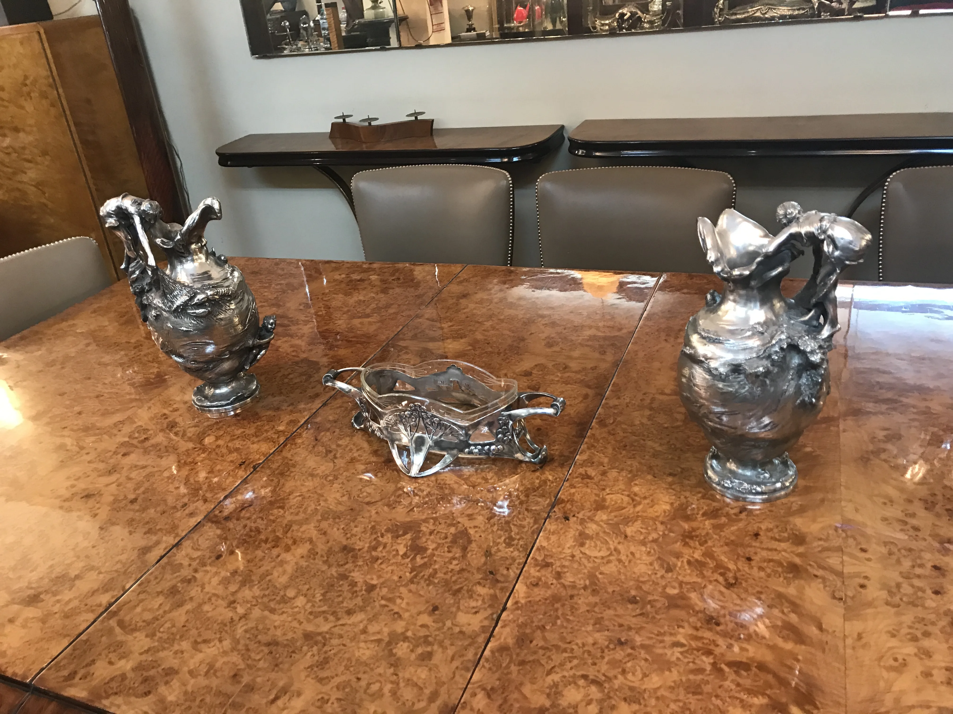 two antique decorative jars on an elegant table