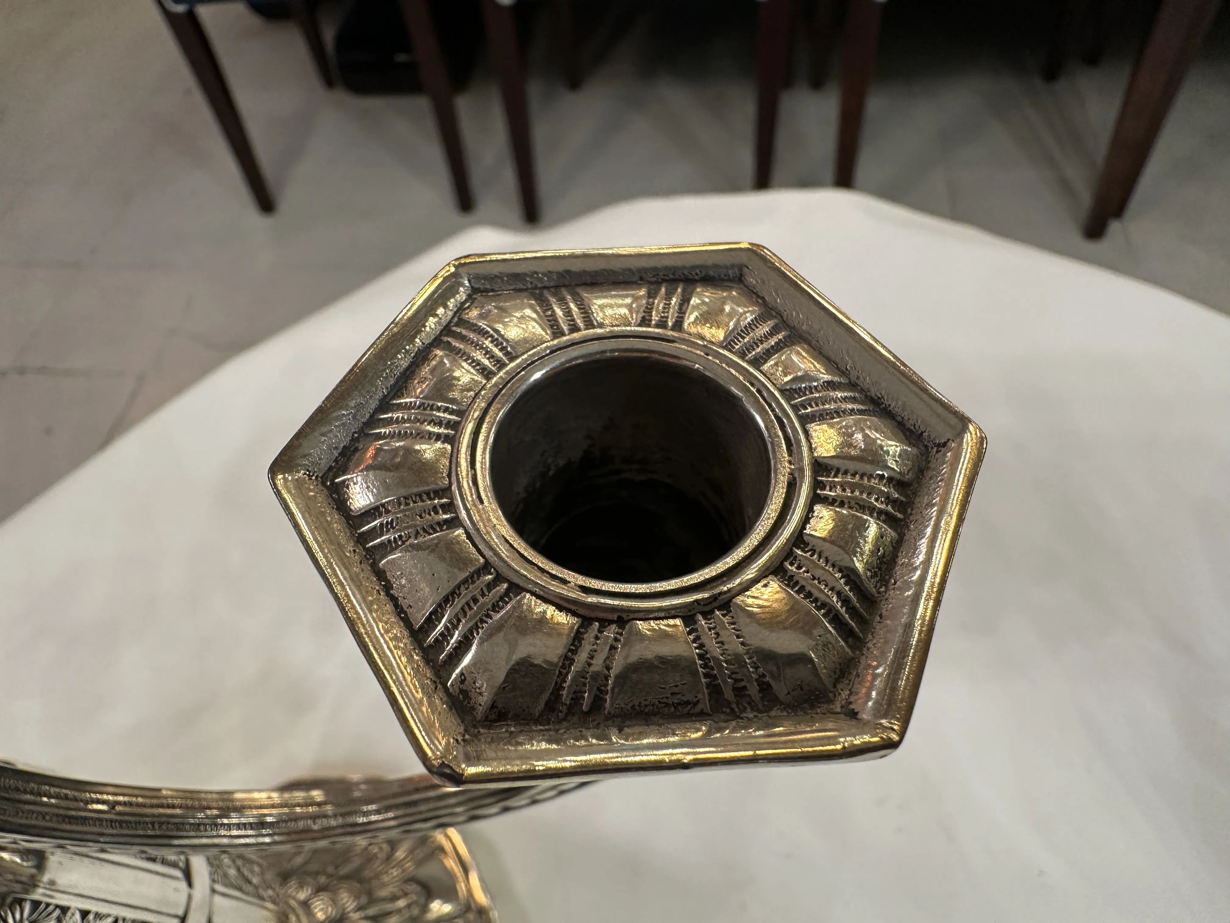 Top view of 2 antique candelabras featuring hexagonal design