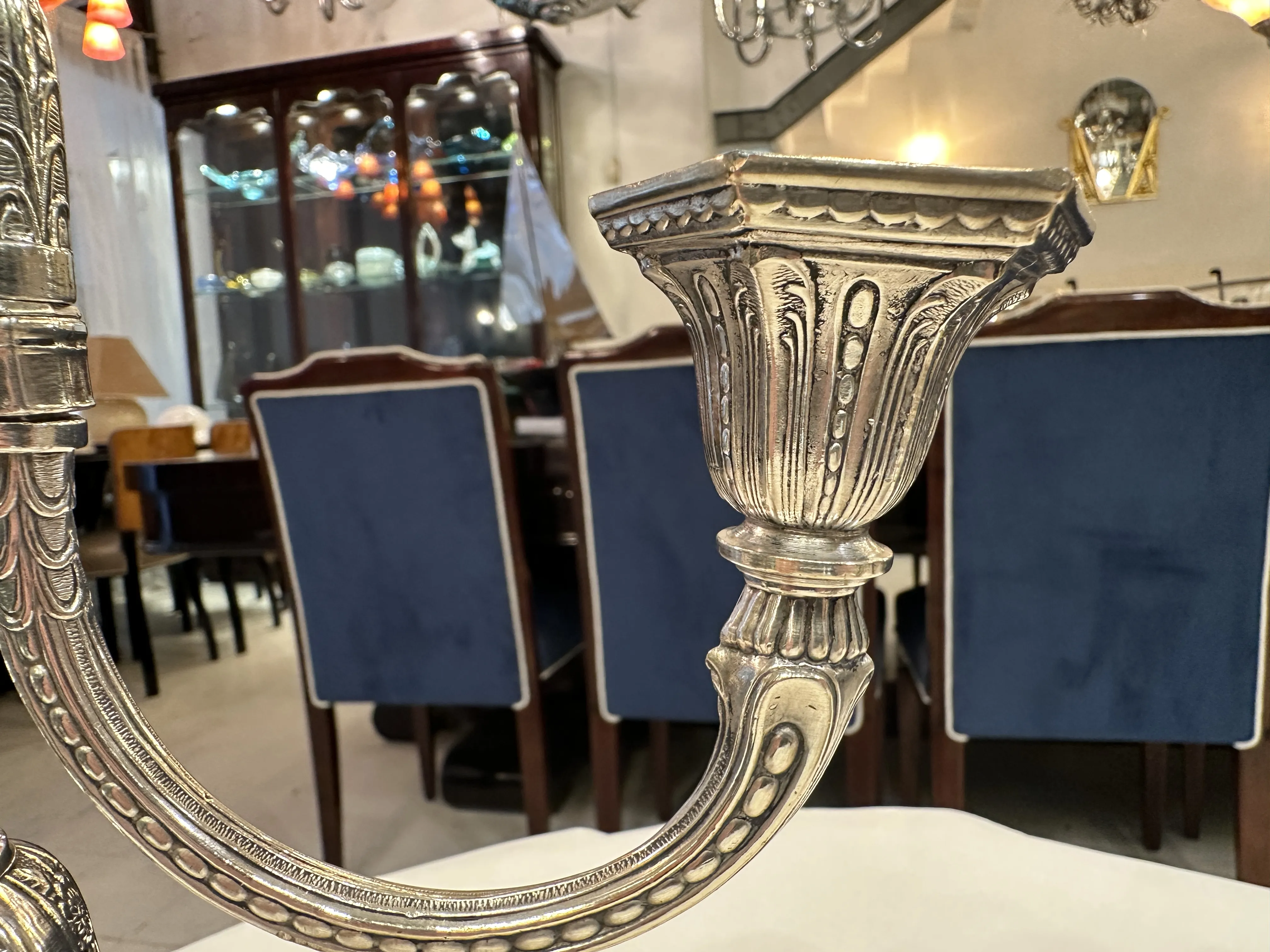 view of two antique candelabras in an elegant setting