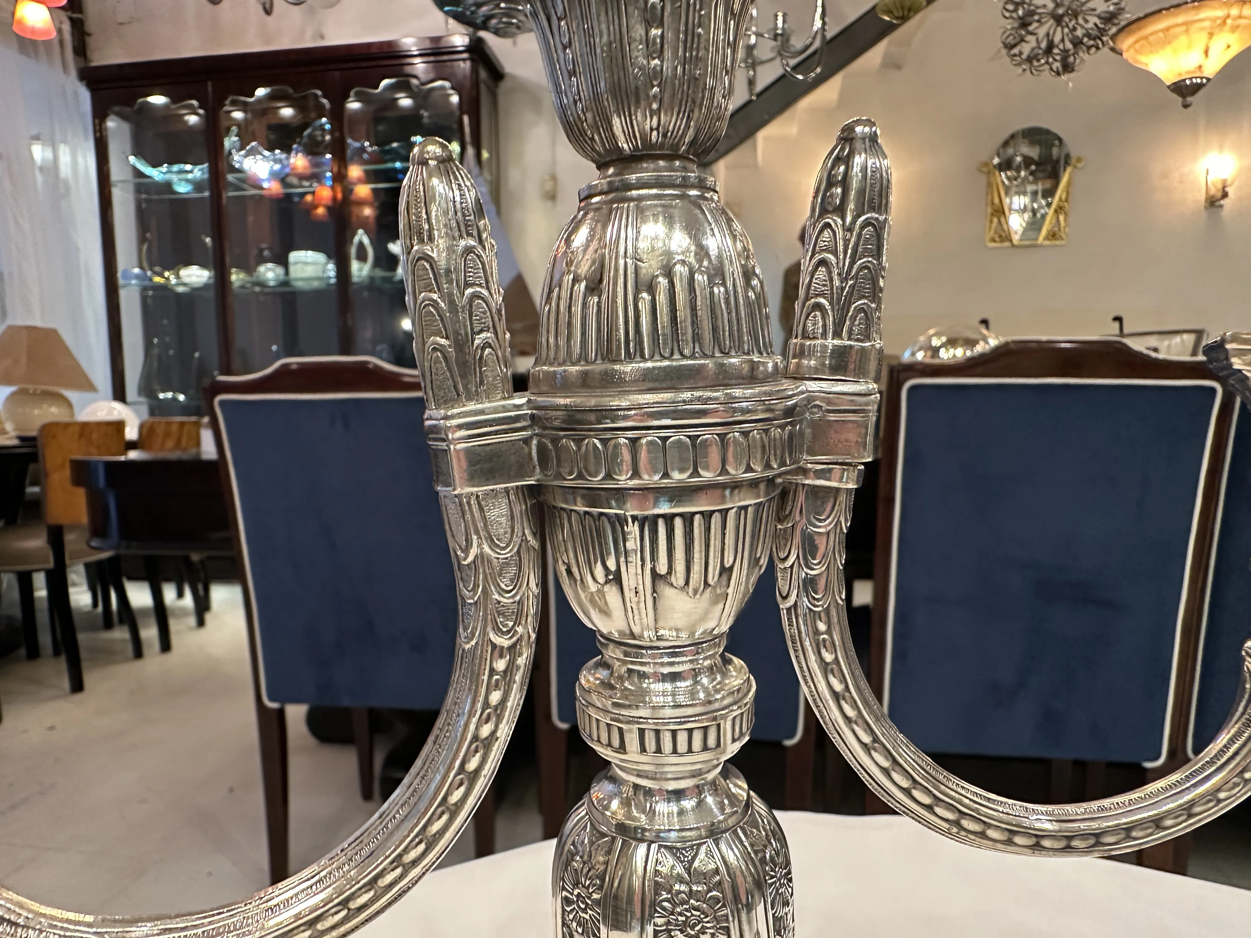 Two antique candelabras in an elegant interior