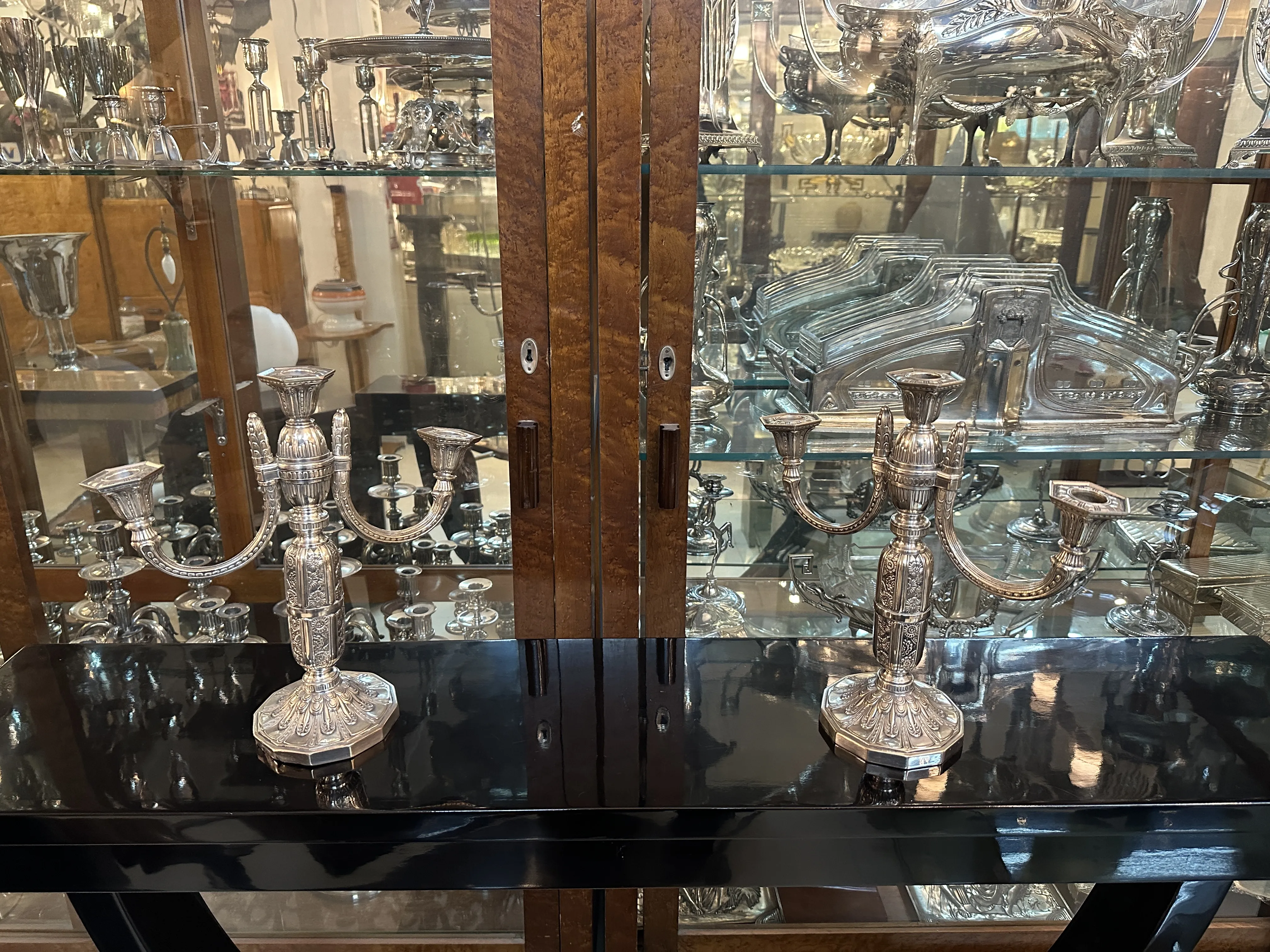 Pair of antique candelabras in an elegant setting