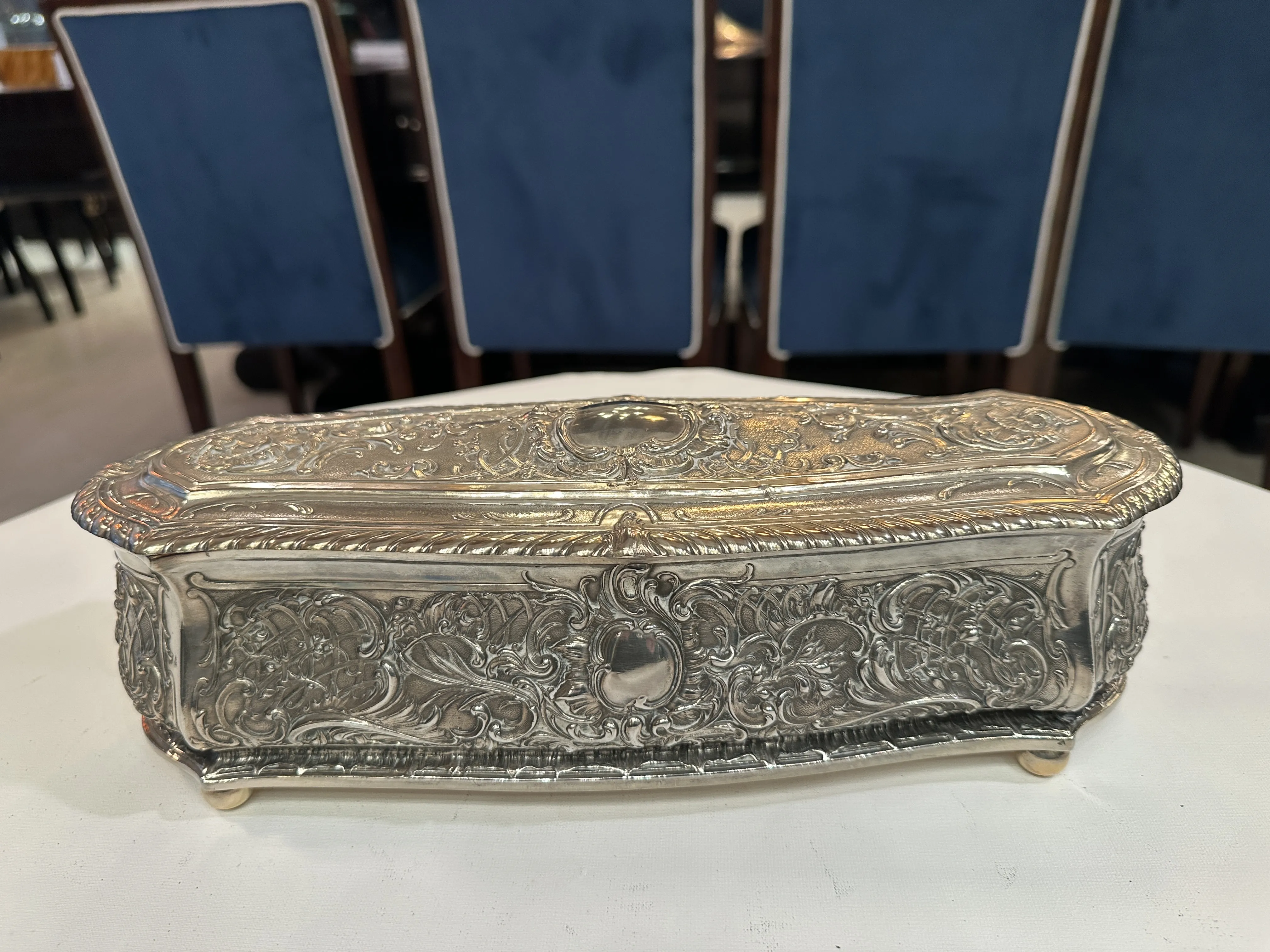 Antique decorative box with intricate detailing in an elegant setting