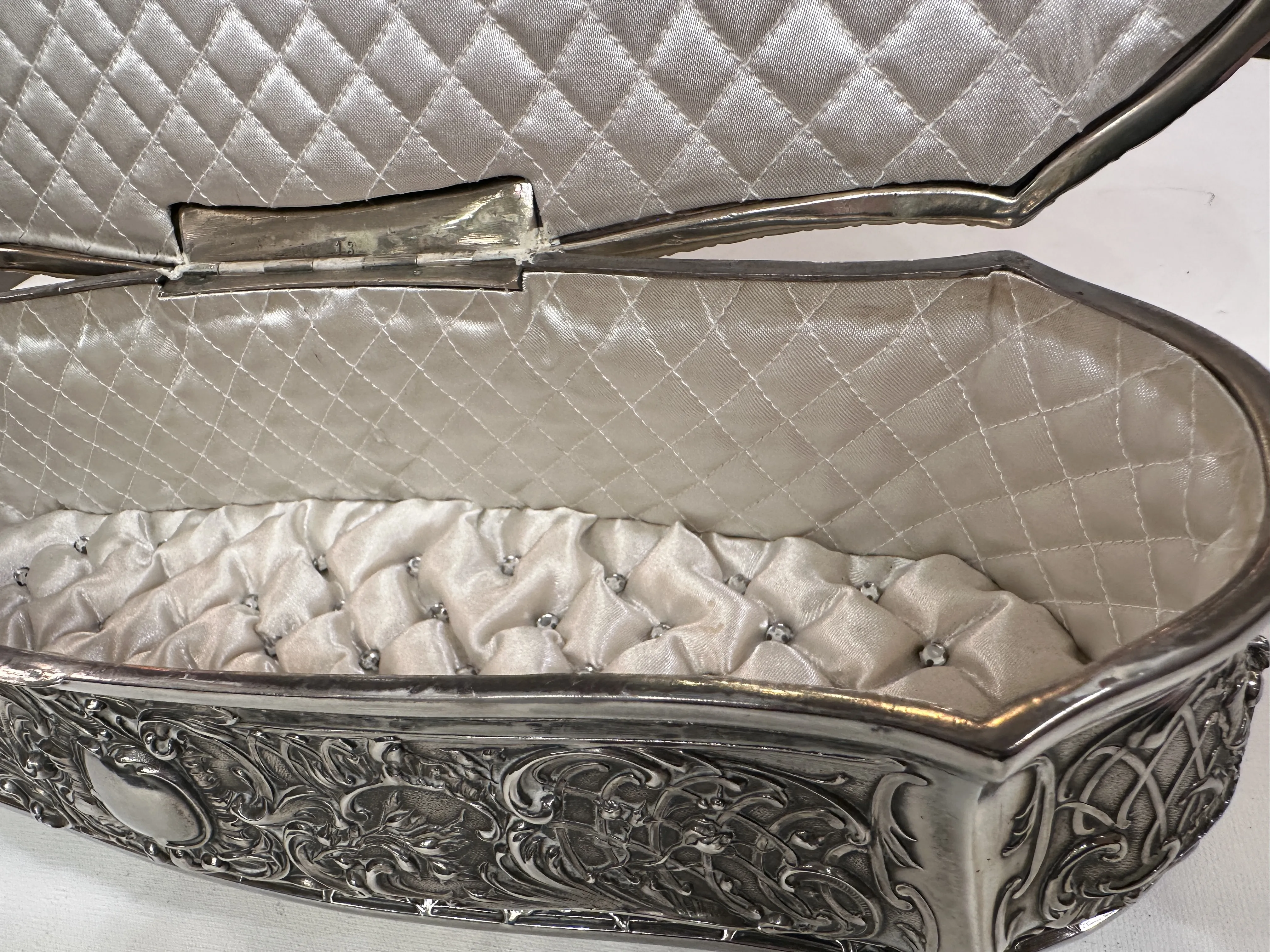 antique box with intricate details and soft lining