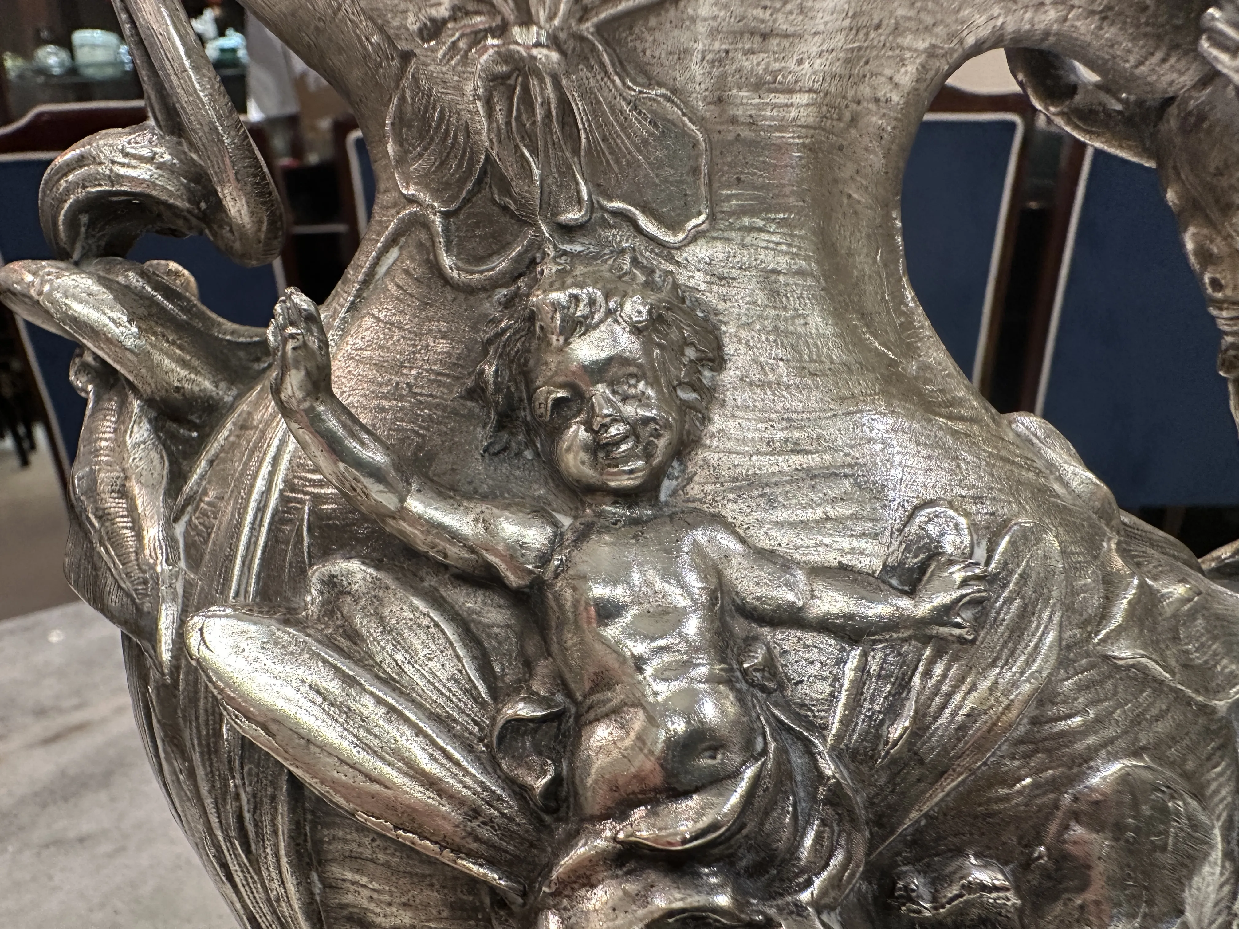 antique jar decorated with child figure and flowers