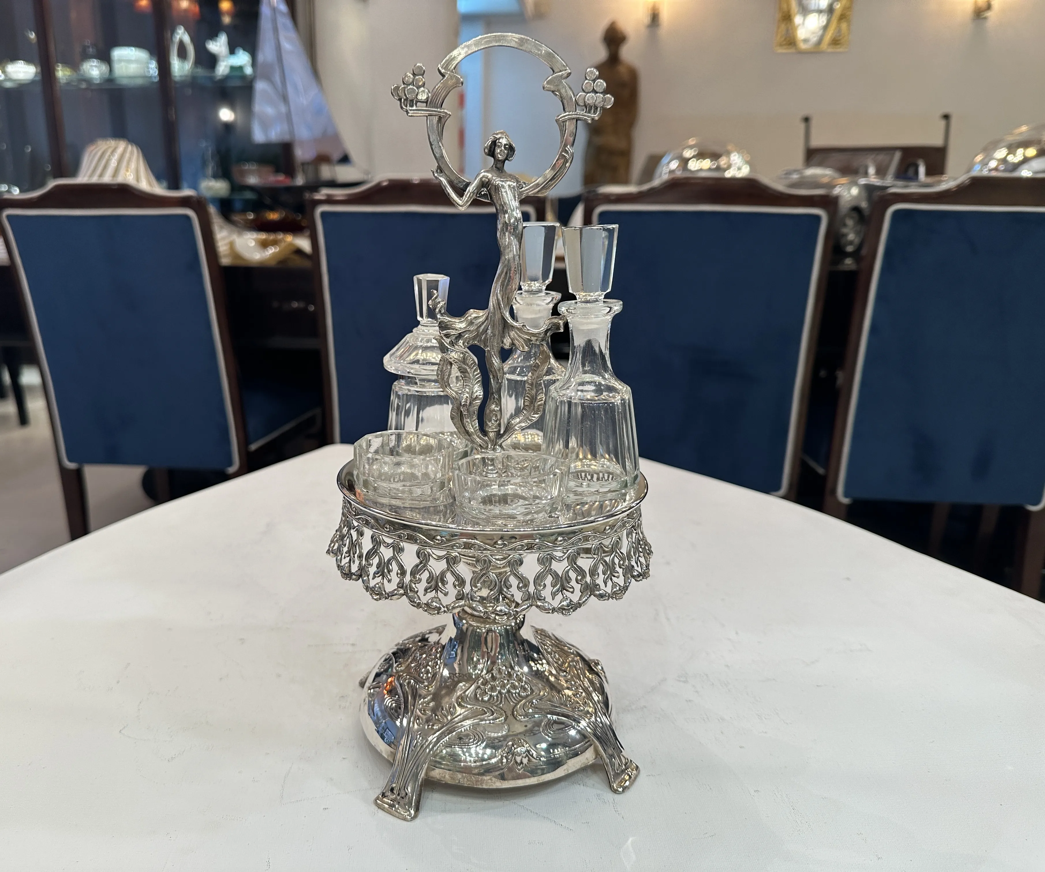 Antique set of salt shaker, pepper shaker, oil and vinegar with elegant design, on white background.