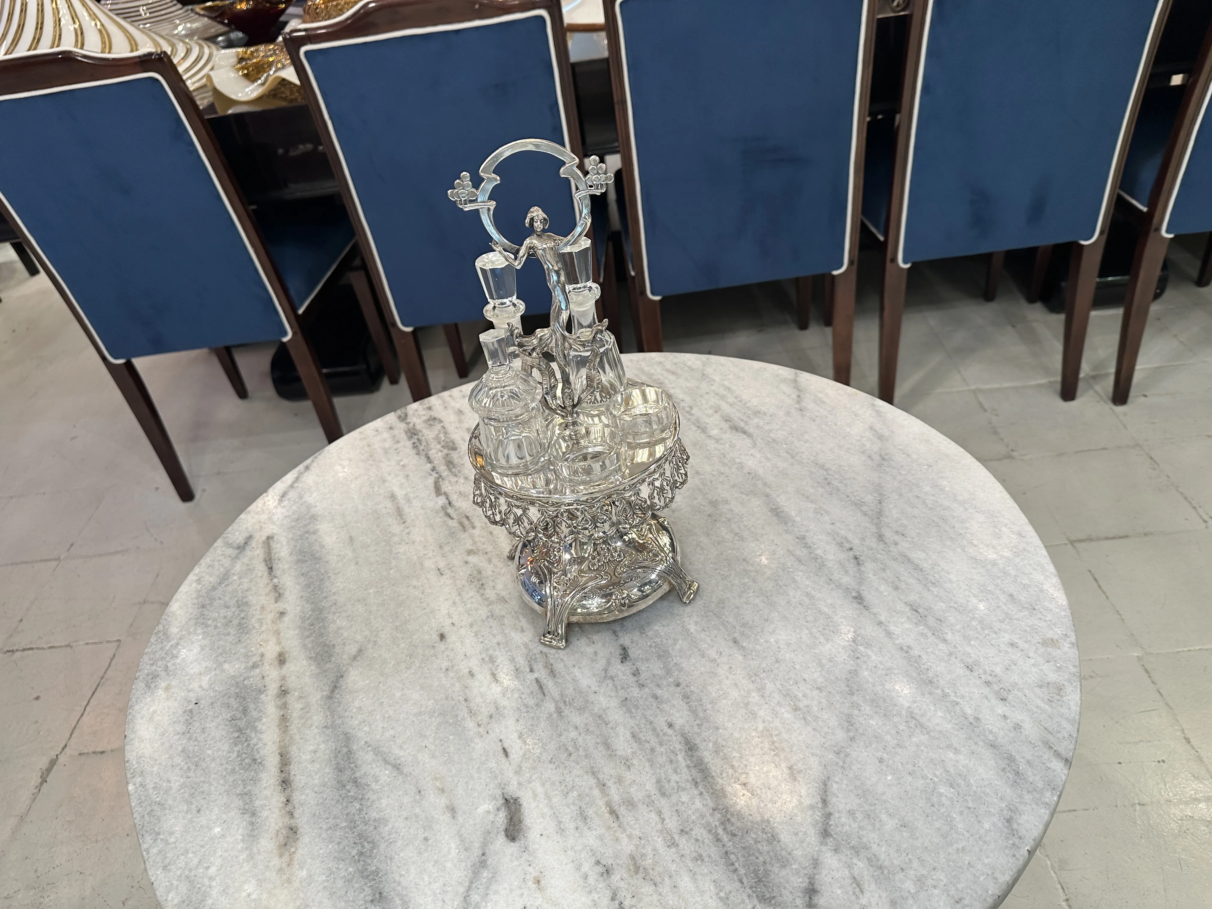 Antique salt and pepper set with oil and vinegar on table