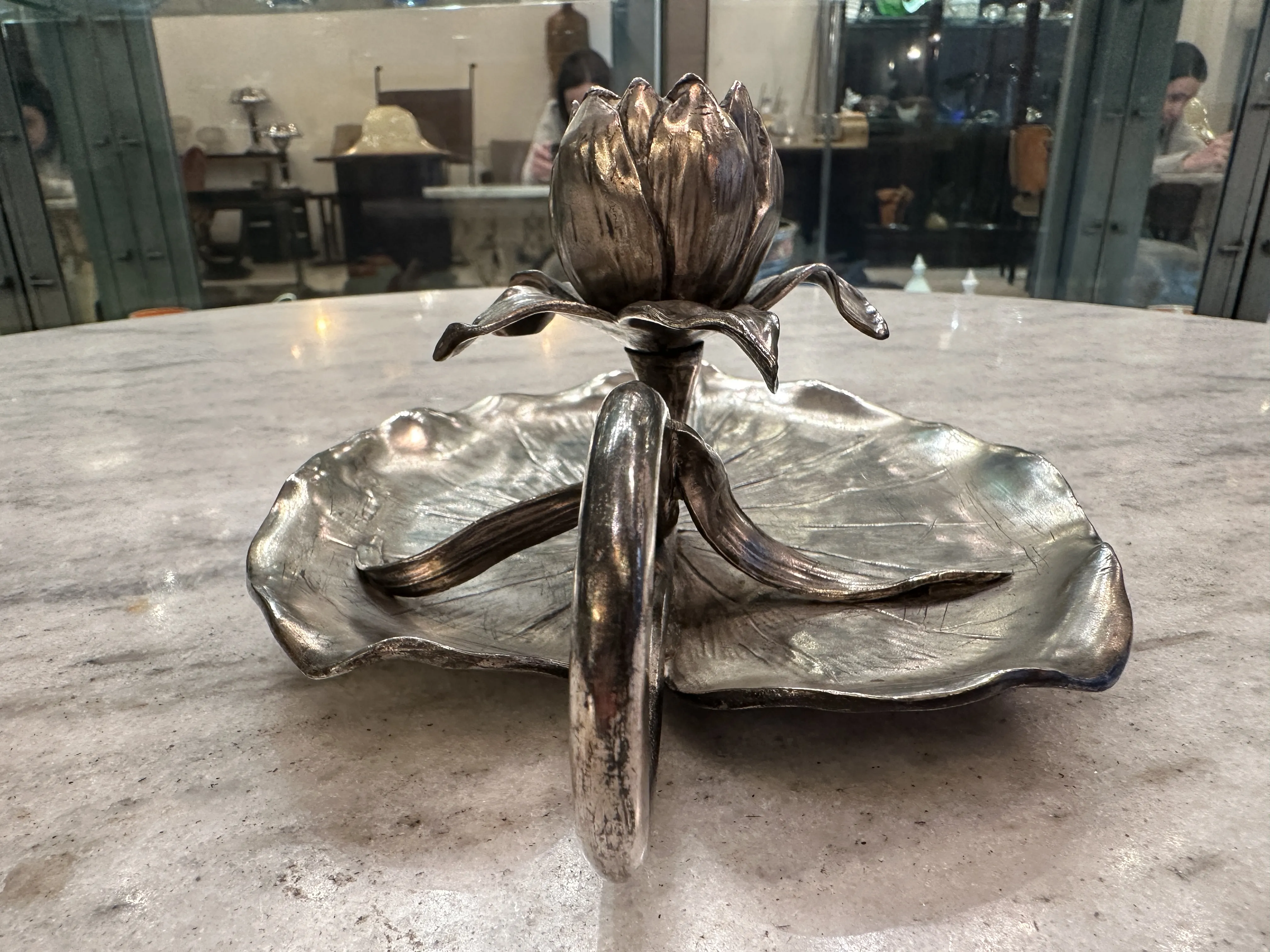 Antique candelabra with floral design, elegant table centerpiece.