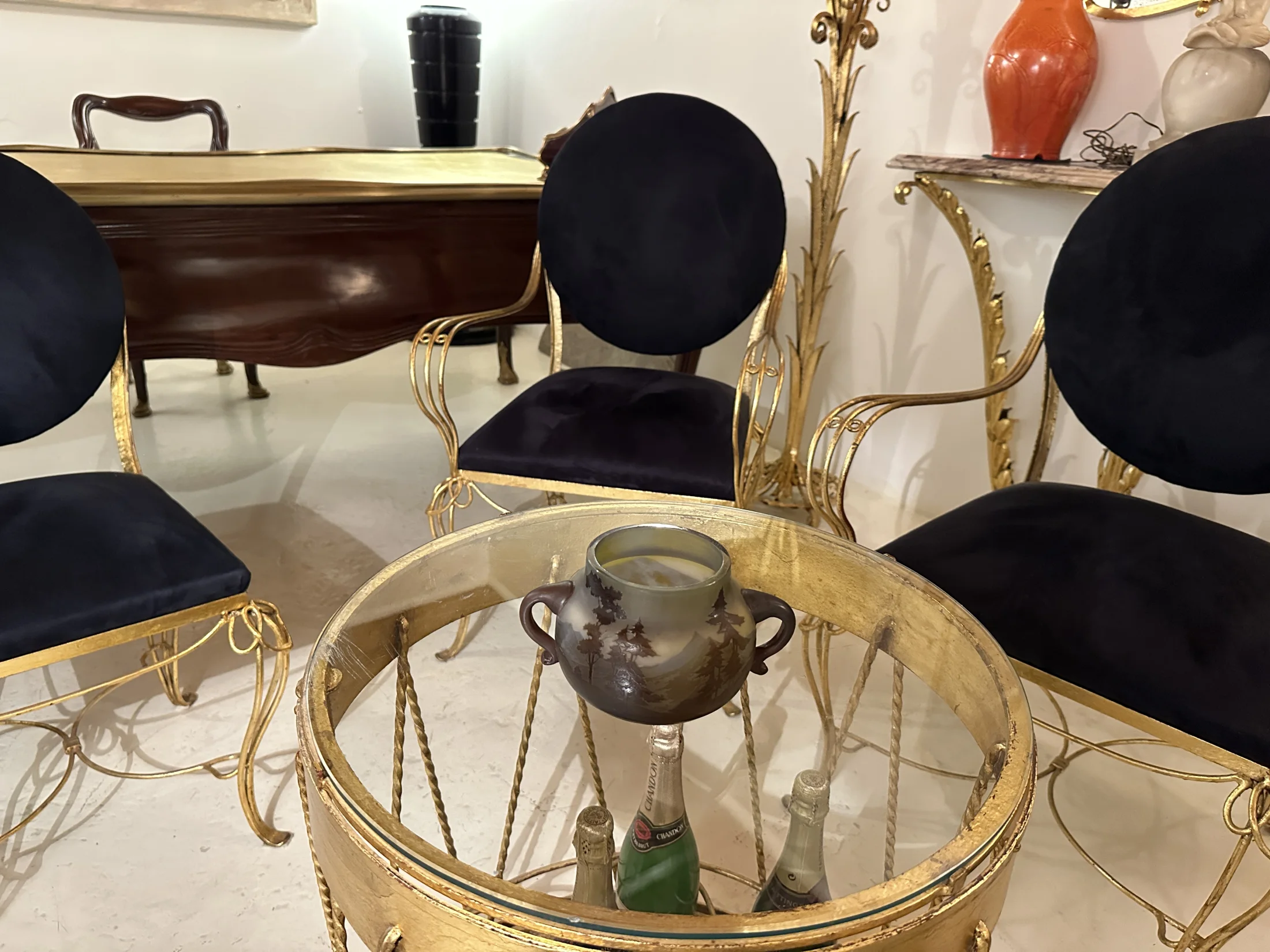 Antique restoration and customization workshop with gold chairs.