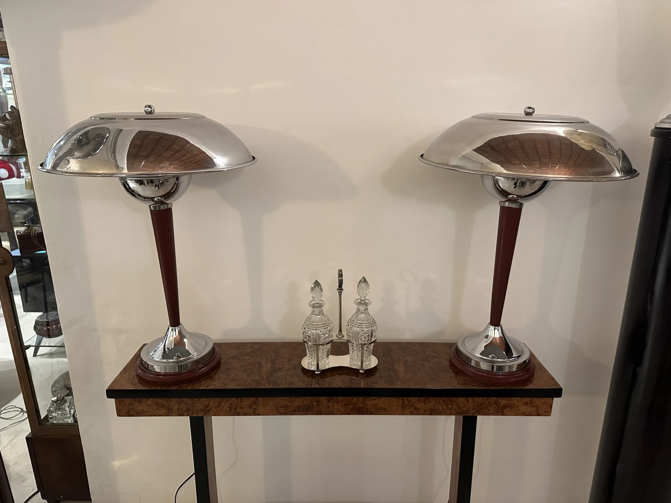 Antique lamps with chrome bases and classic designs.