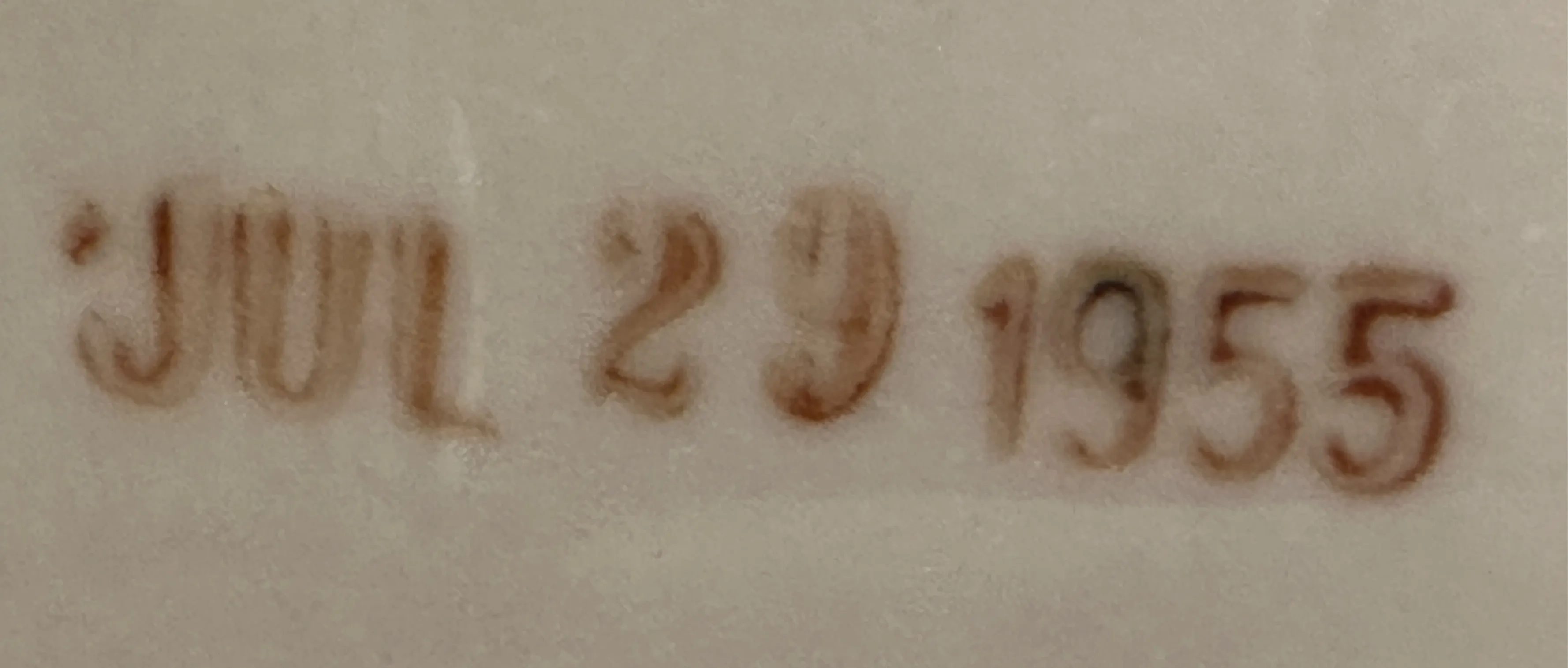 selo antigo com inscrição jul 29 1955 em fundo claro