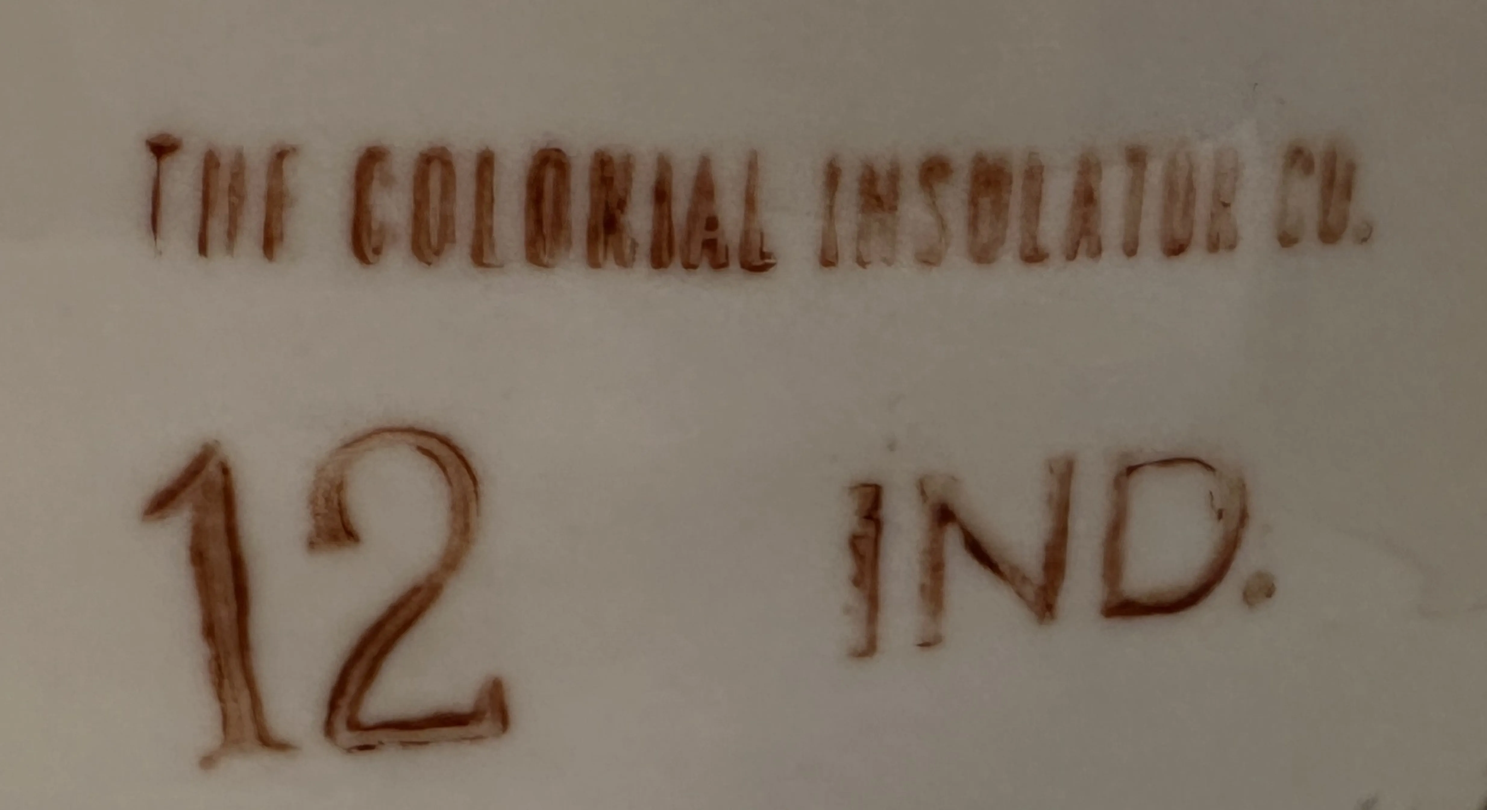 selo antigo com inscrições da colonial insulator company